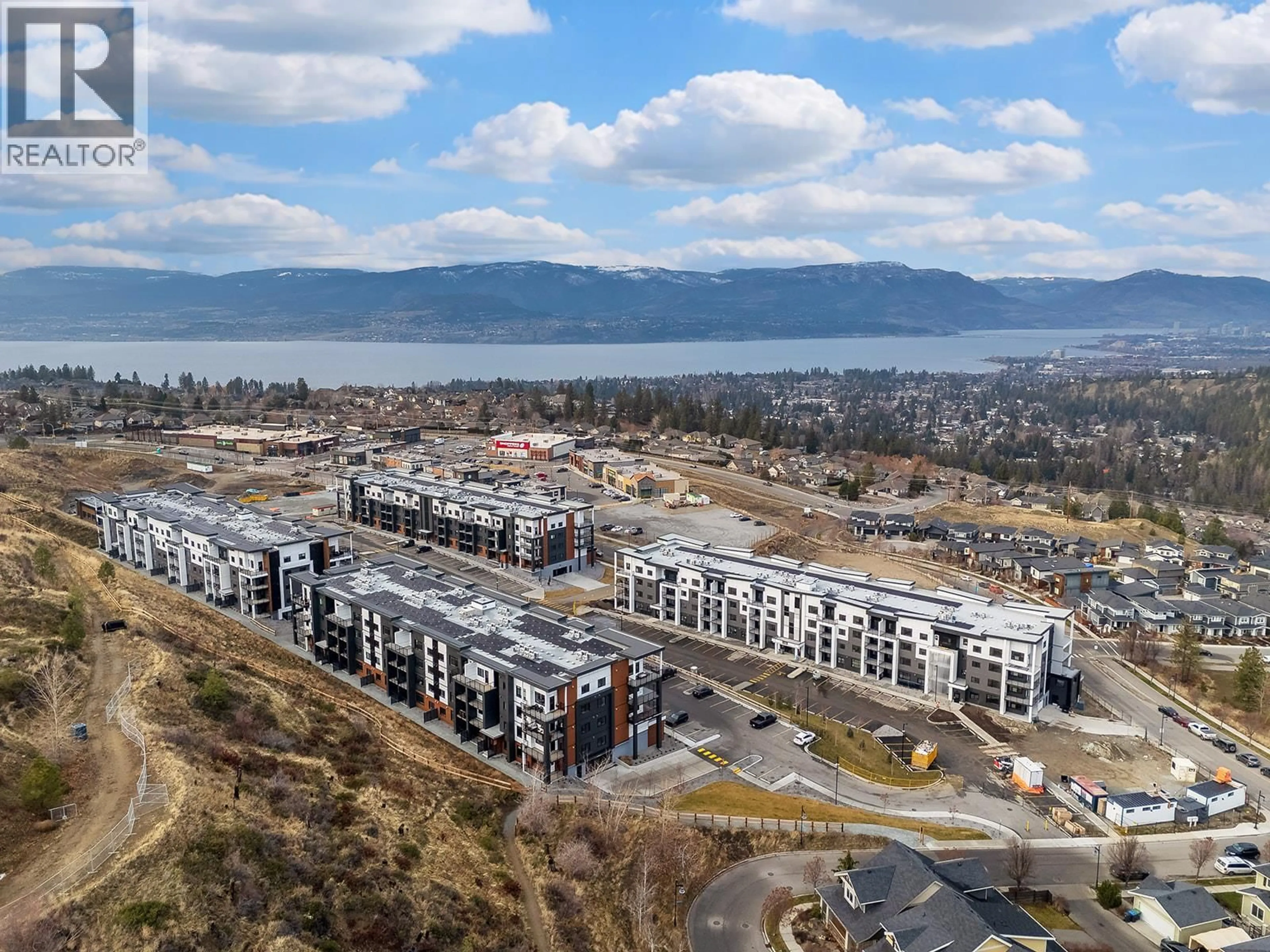 A pic from outside/outdoor area/front of a property/back of a property/a pic from drone, mountain view for 217 - 1057 FROST ROAD, Kelowna British Columbia V1W0G7