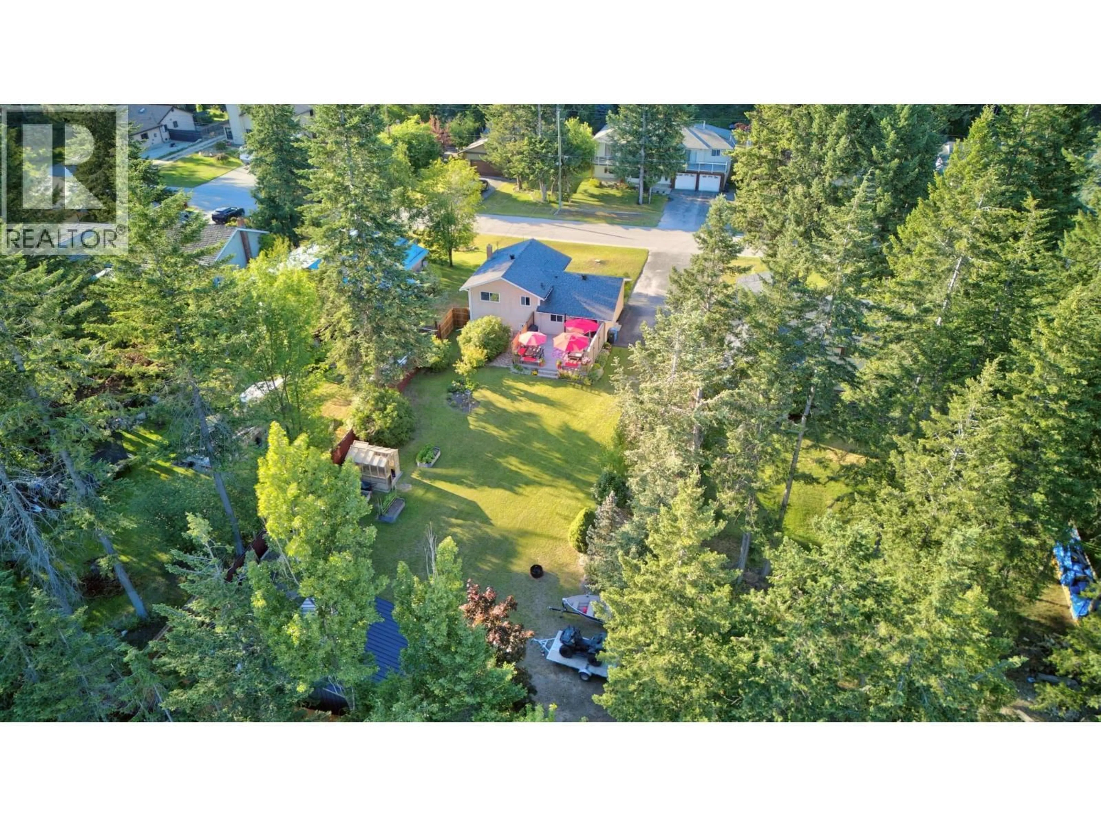 A pic from outside/outdoor area/front of a property/back of a property/a pic from drone, forest/trees view for 1325 PINE DRIVE, Golden British Columbia V0A1H1