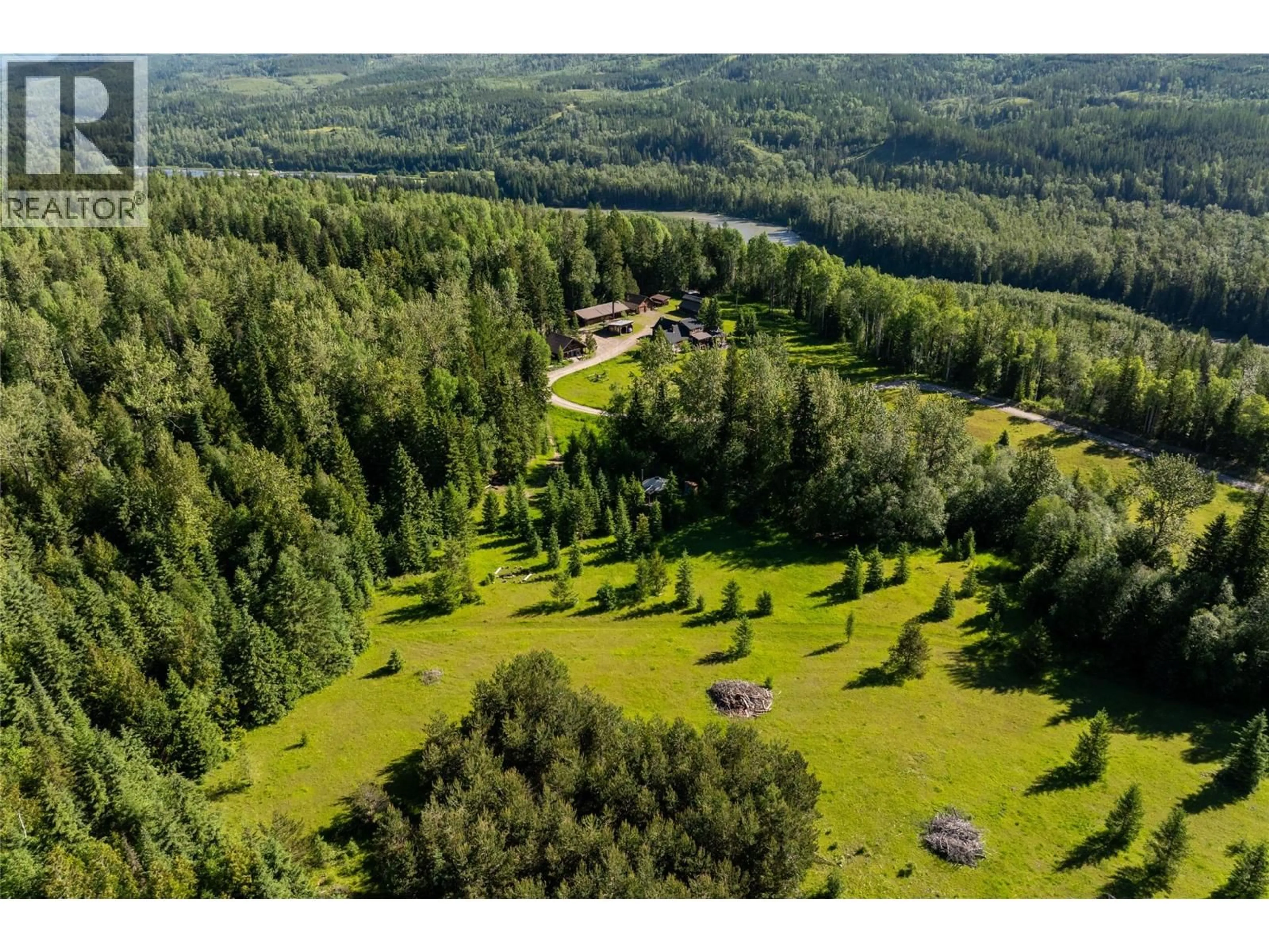A pic from outside/outdoor area/front of a property/back of a property/a pic from drone, forest/trees view for 4485 HIGHWAY 3 OTHER, Fernie British Columbia V0B1M1