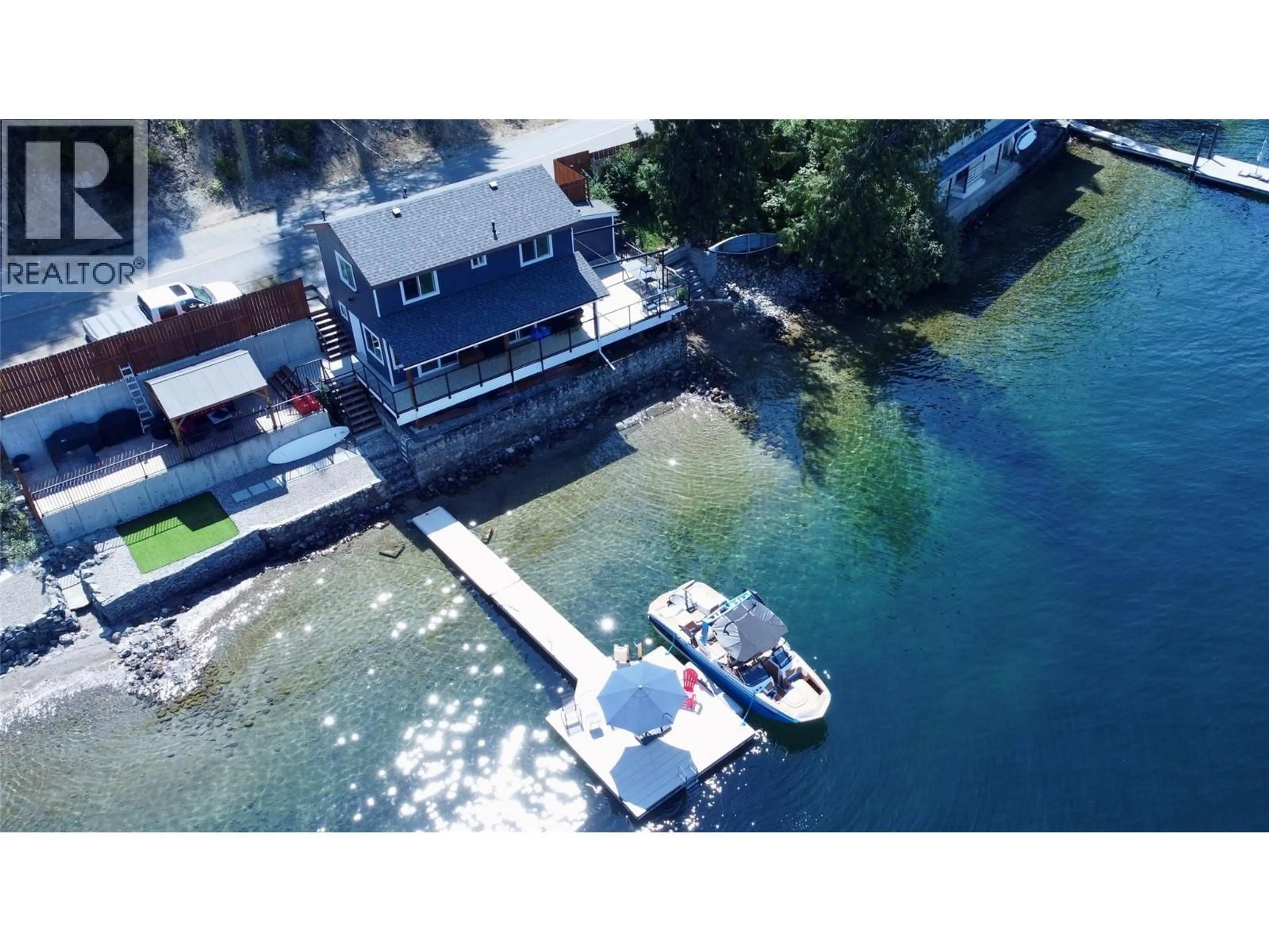 A pic from outside/outdoor area/front of a property/back of a property/a pic from drone, water/lake/river/ocean view for 3109 EAST LAKE DRIVE, Christina Lake British Columbia V0H1E1
