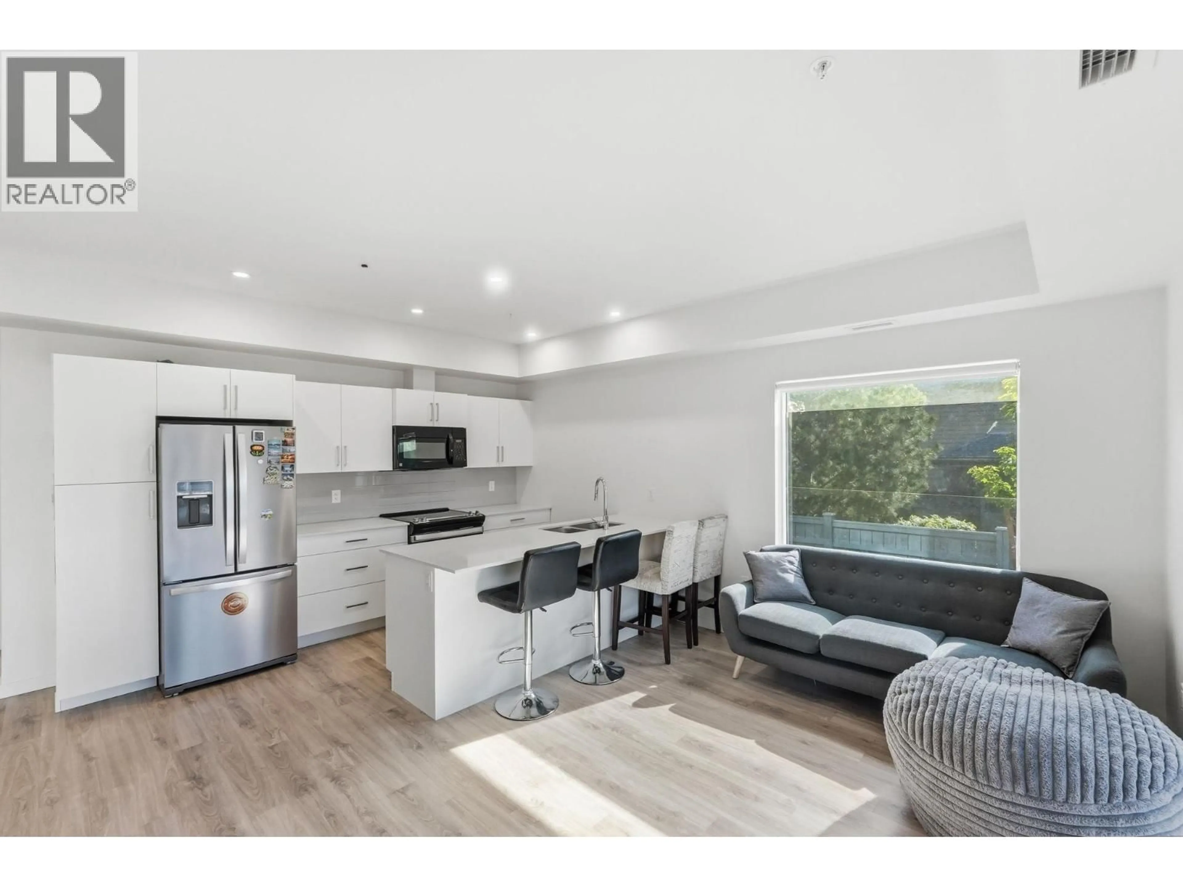 Open concept kitchen, wood/laminate floor for 112 - 2345 BUTT ROAD, Westbank British Columbia V4T0G2