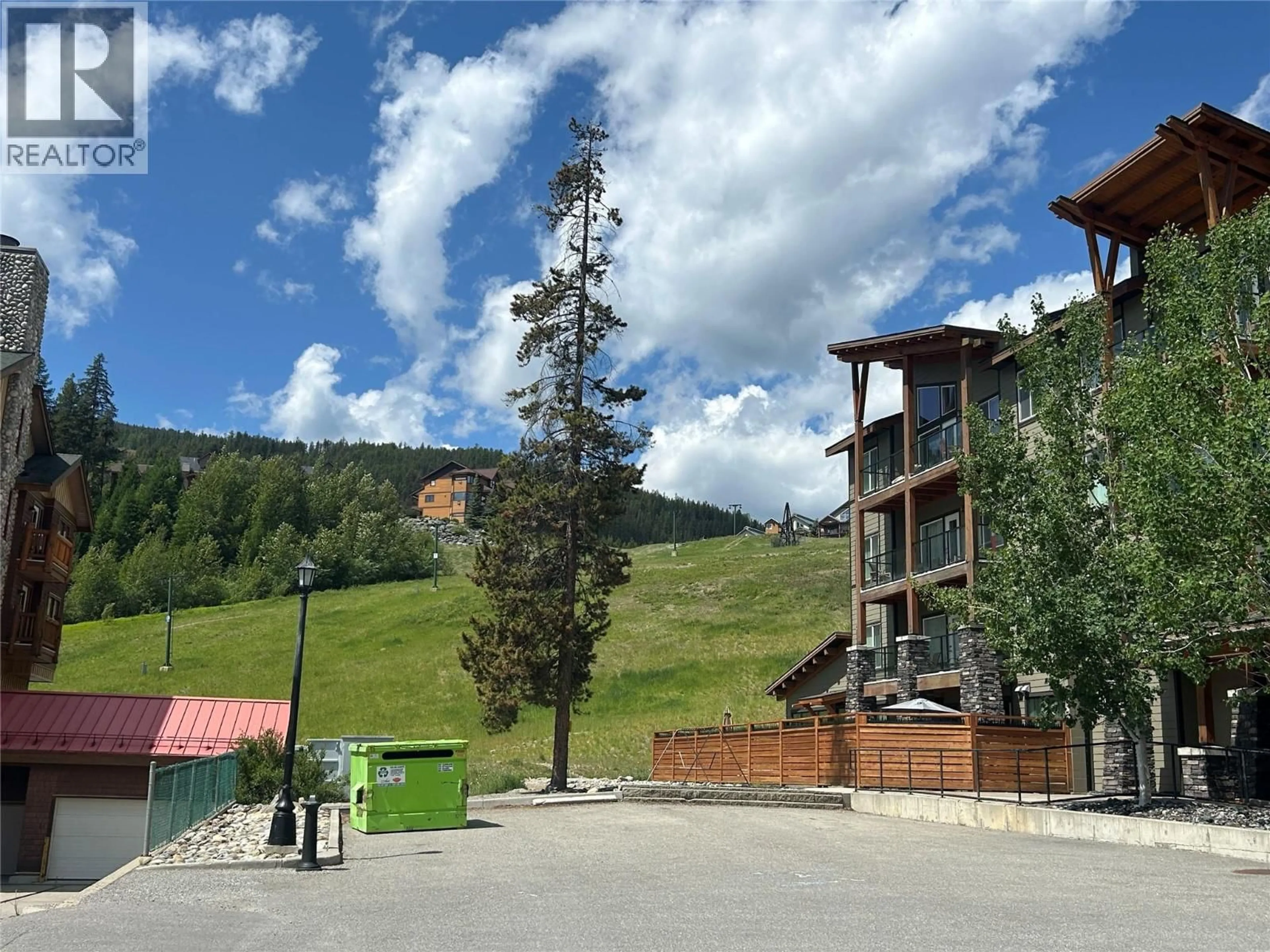 A pic from outside/outdoor area/front of a property/back of a property/a pic from drone, mountain view for 413 - 400 STEMWINDER DRIVE, Kimberley British Columbia V1A3E9