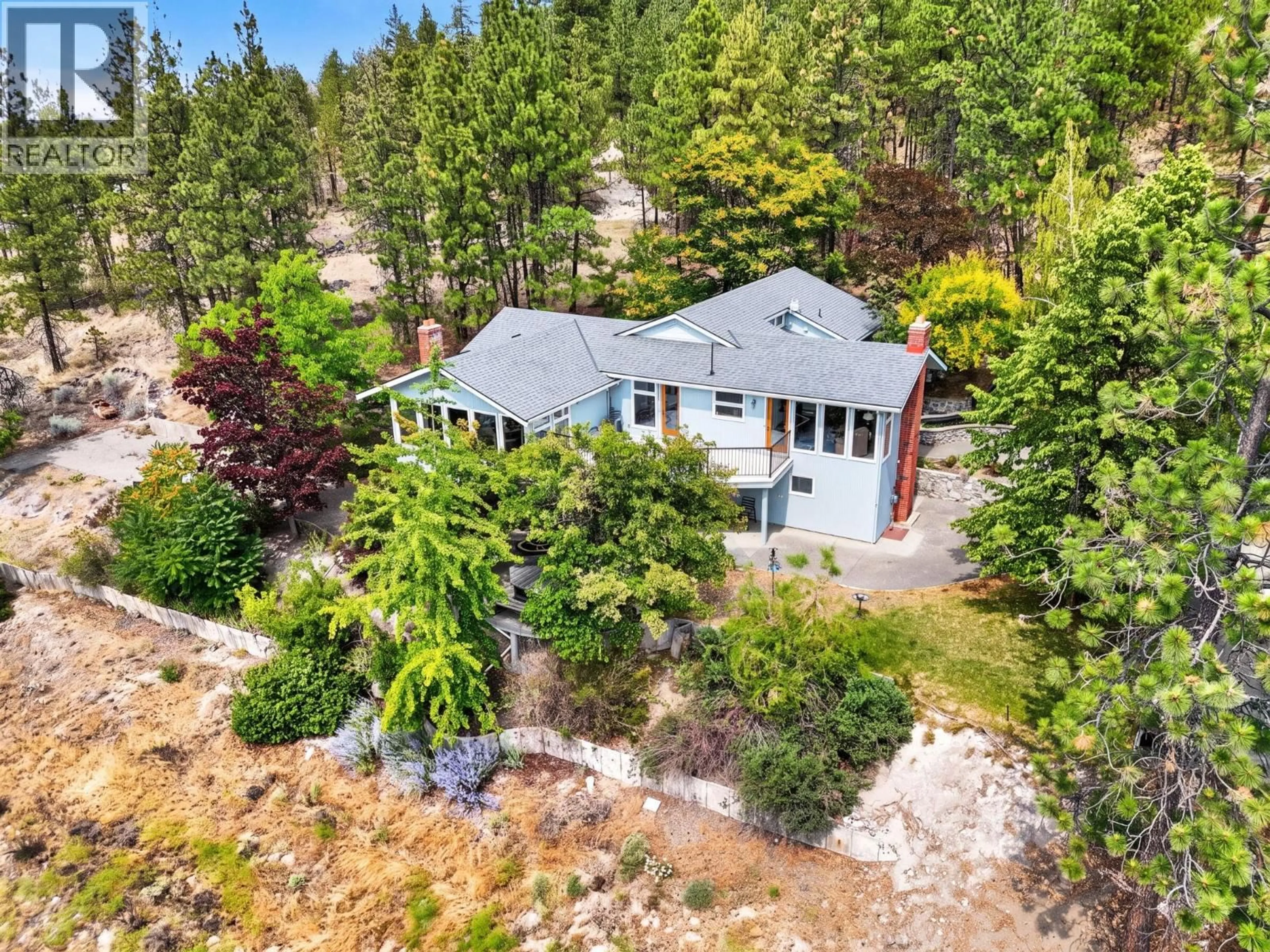 A pic from outside/outdoor area/front of a property/back of a property/a pic from drone, forest/trees view for 9251 TYNDALL ROAD, Lake Country British Columbia V4V1N3