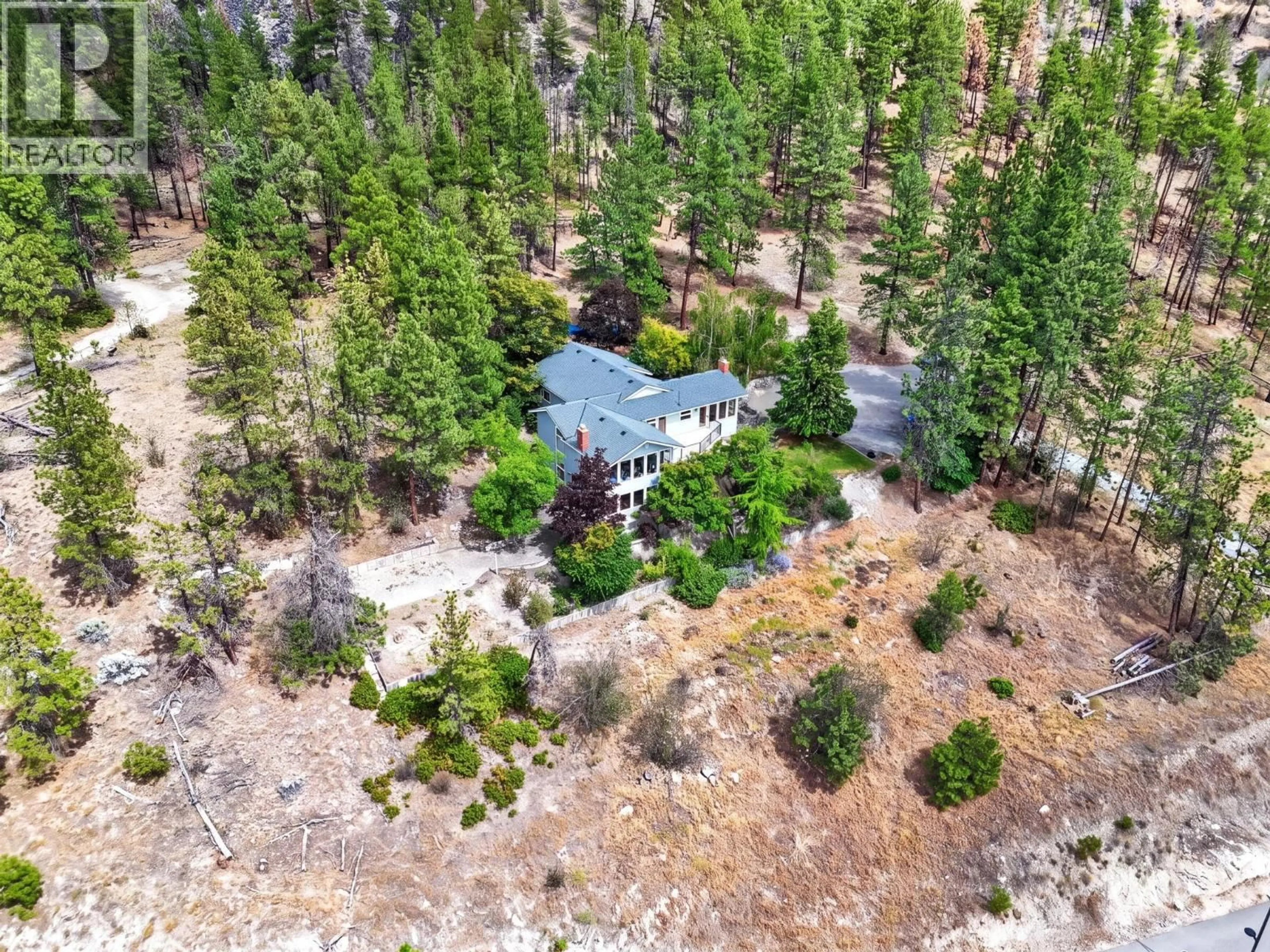 A pic from outside/outdoor area/front of a property/back of a property/a pic from drone, forest/trees view for 9251 TYNDALL ROAD, Lake Country British Columbia V4V1N3