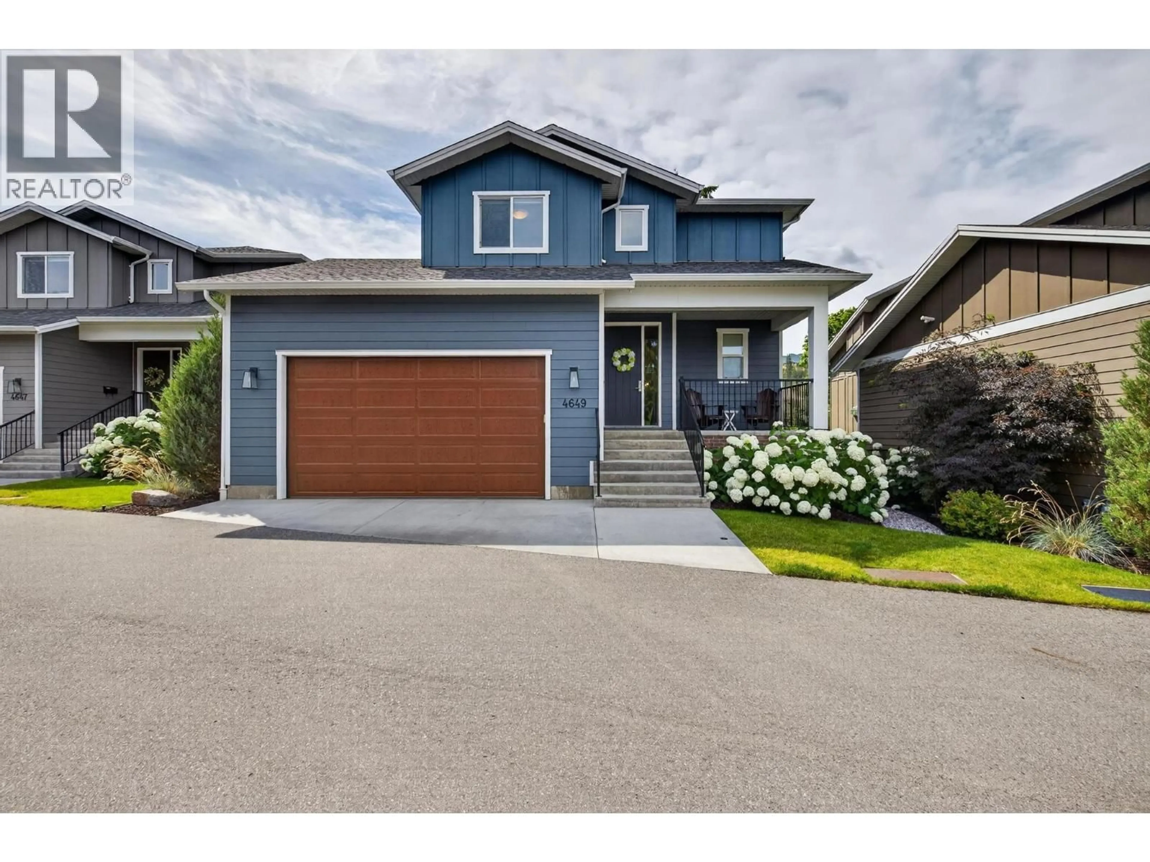 Home with vinyl exterior material, street for 4649 RAYMER ROAD, Kelowna British Columbia V1W1J4