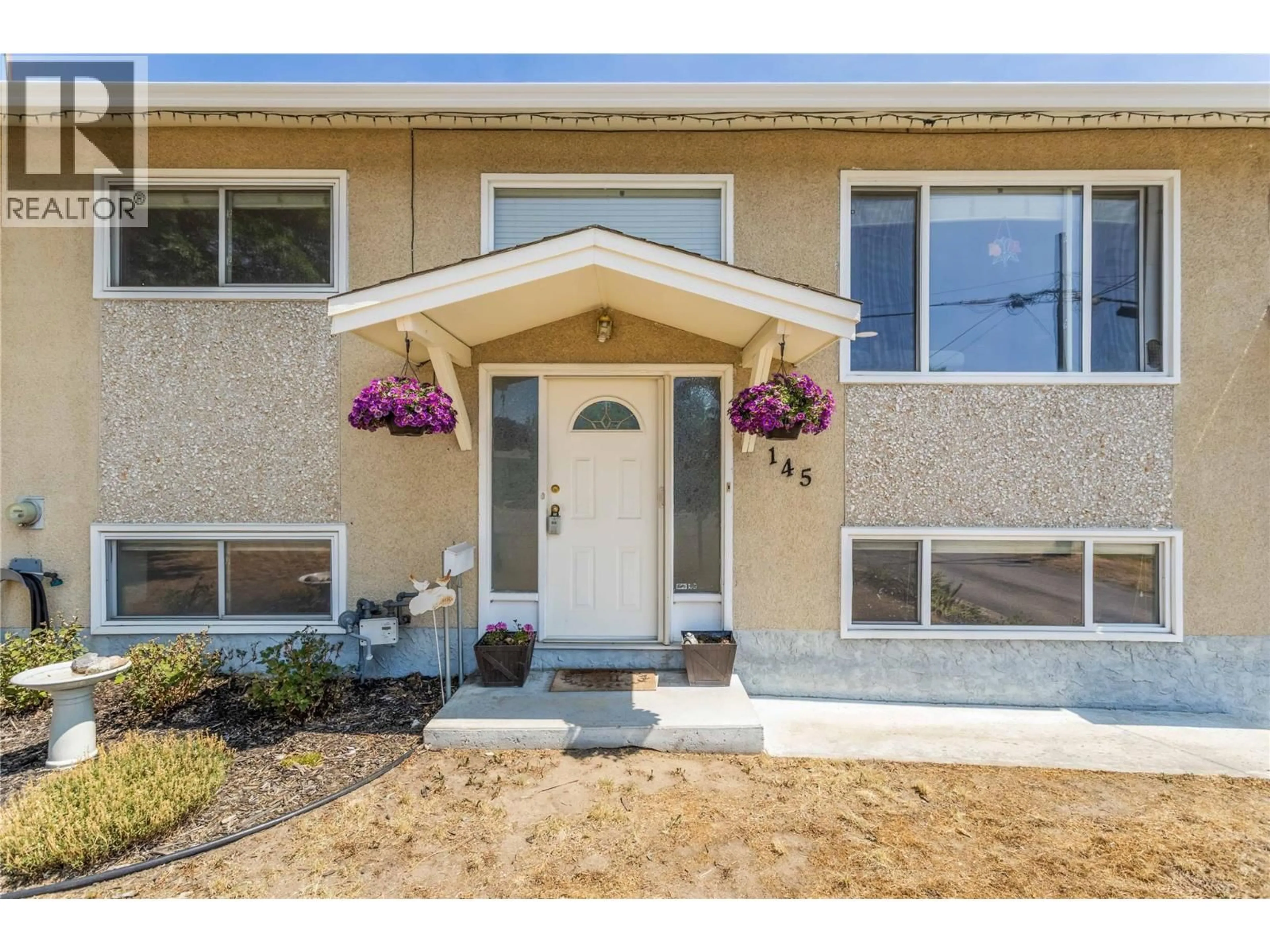 Home with vinyl exterior material, street for 145 GIBBS ROAD EAST, Kelowna British Columbia V1X2V8