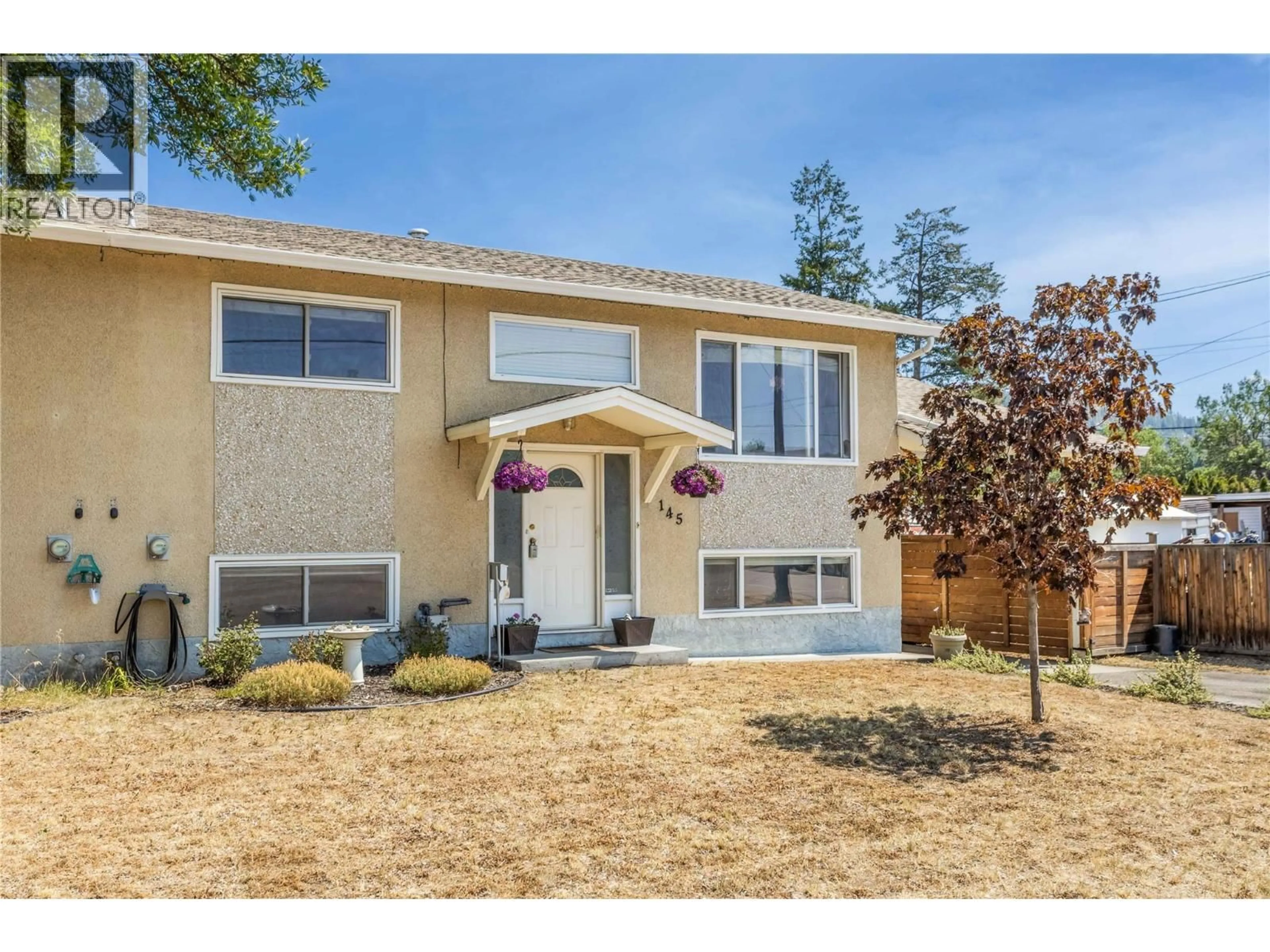 Home with vinyl exterior material, street for 145 GIBBS ROAD EAST, Kelowna British Columbia V1X2V8