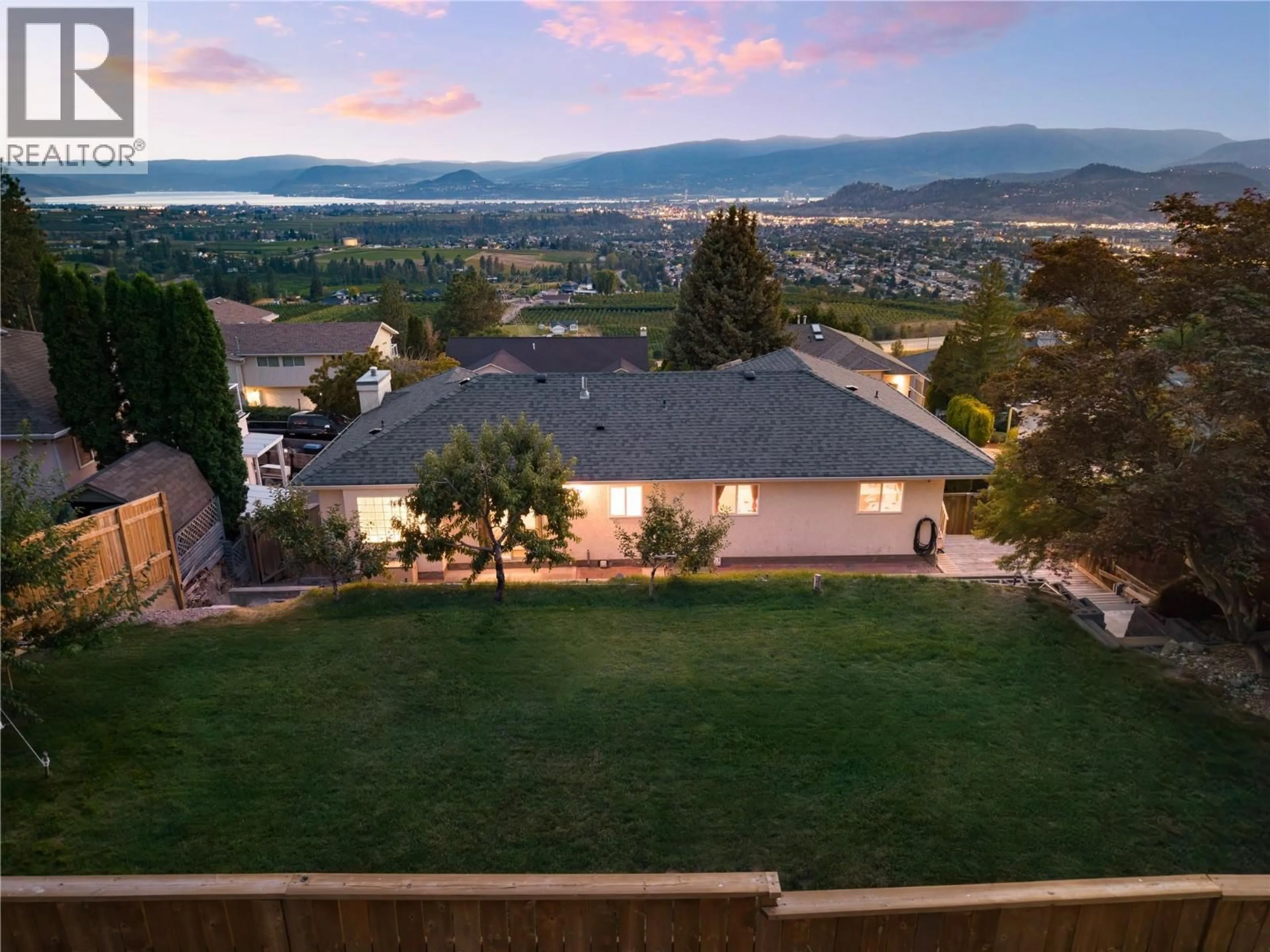 A pic from outside/outdoor area/front of a property/back of a property/a pic from drone, mountain view for 877 TOOVEY ROAD, Kelowna British Columbia V1X6R2