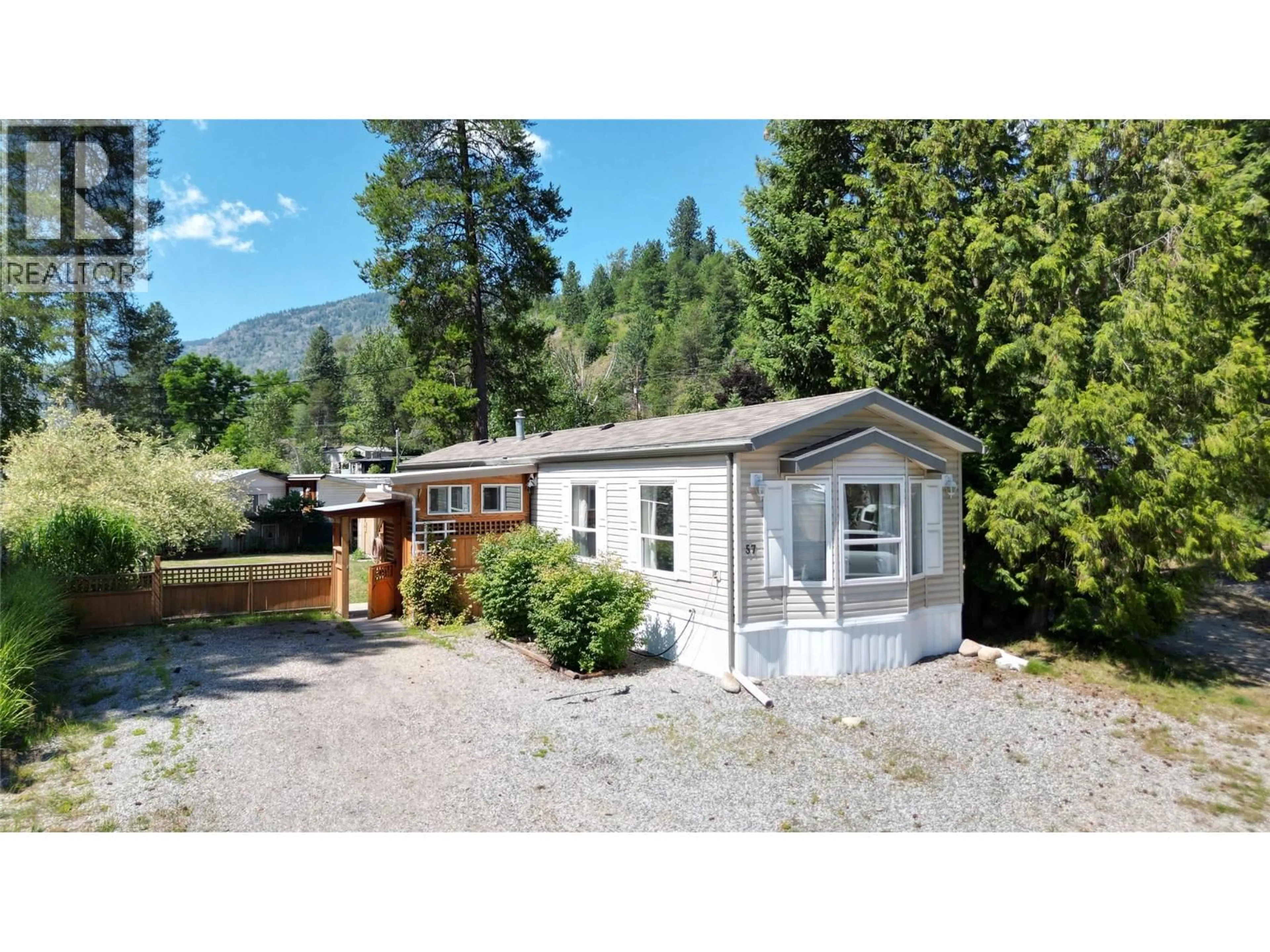 Home with vinyl exterior material, mountain view for 57 - 500 16TH AVENUE, Genelle British Columbia V0G1G0