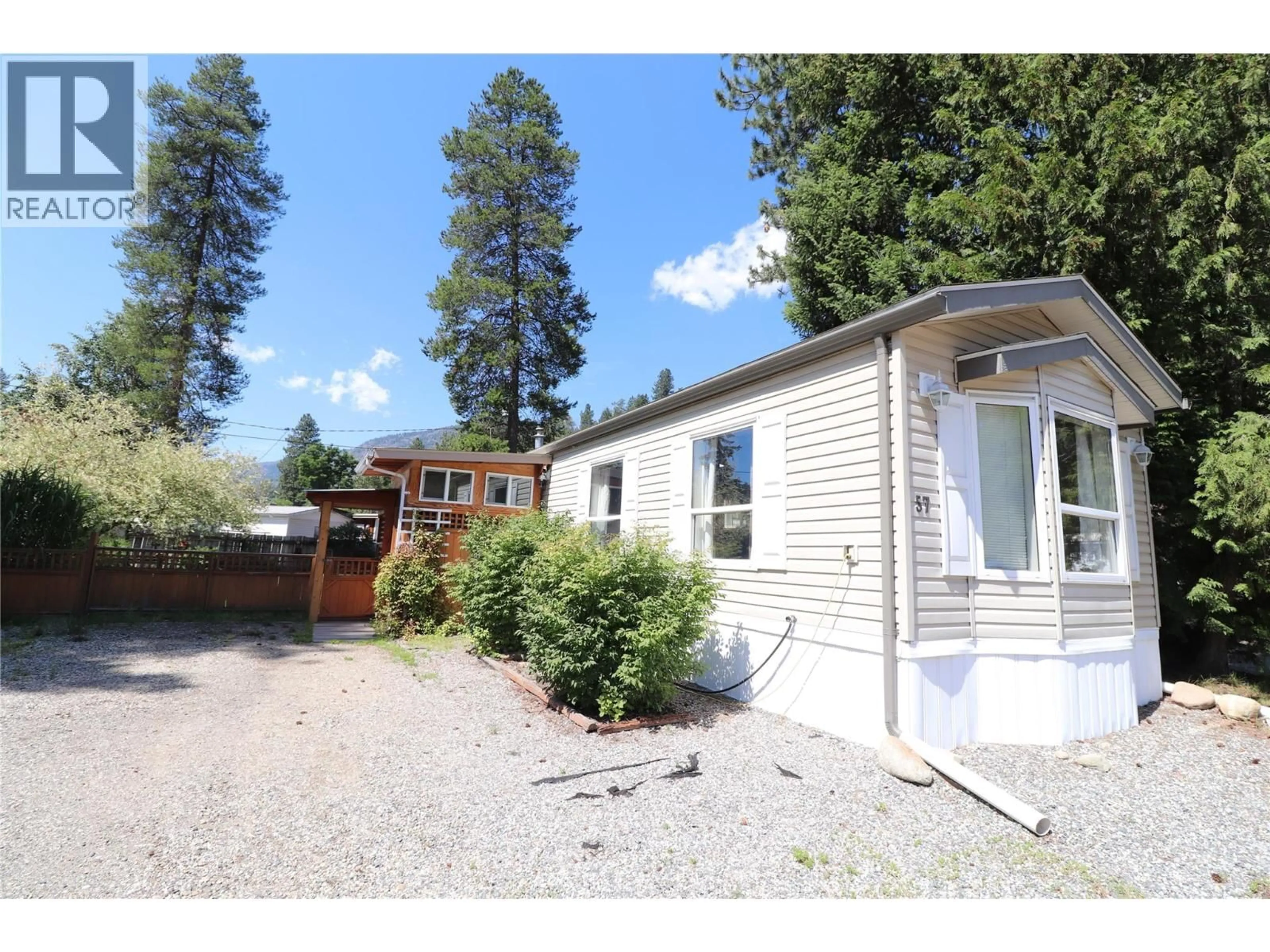 Home with vinyl exterior material, mountain view for 57 - 500 16TH AVENUE, Genelle British Columbia V0G1G0
