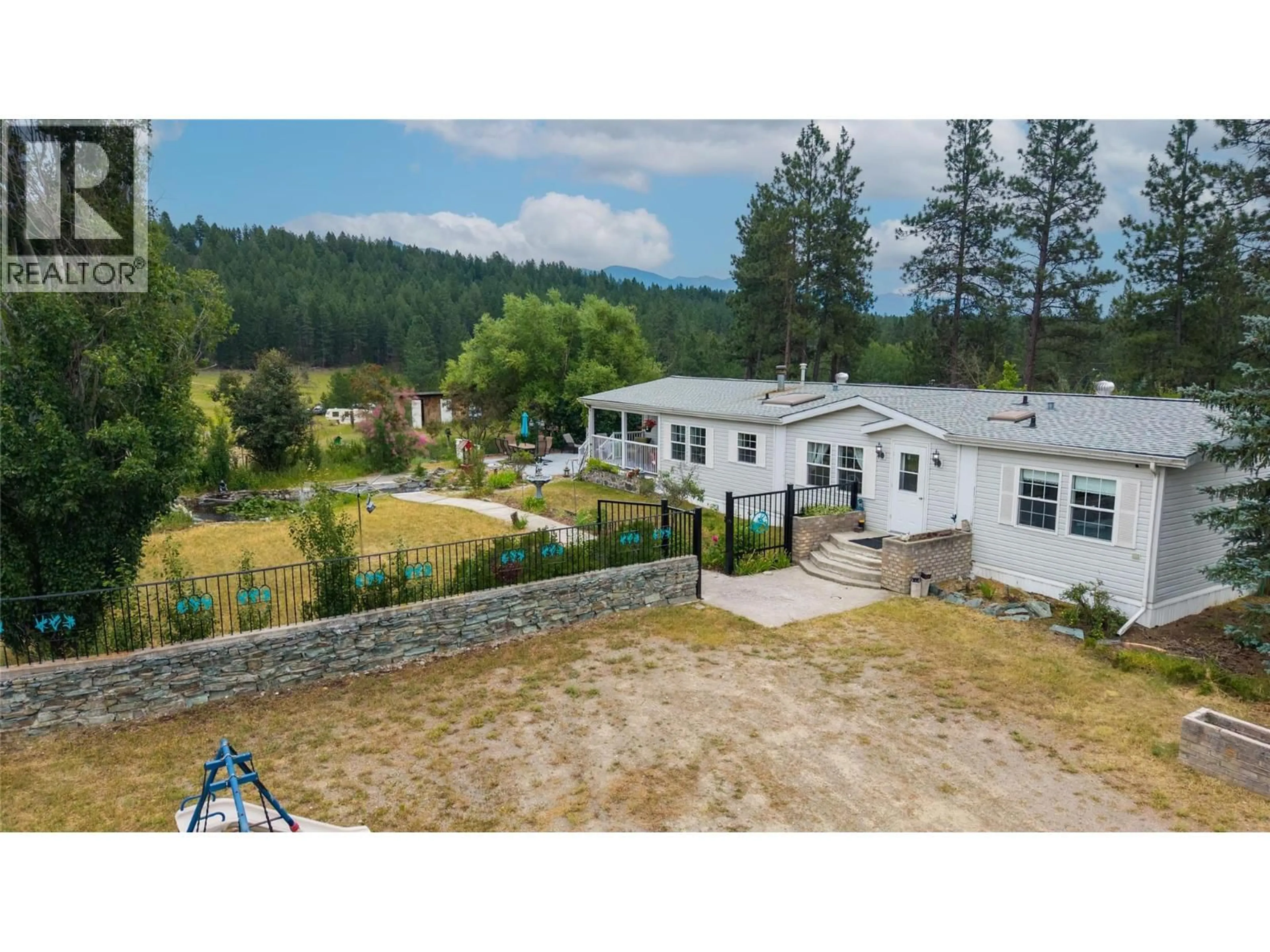 A pic from outside/outdoor area/front of a property/back of a property/a pic from drone, mountain view for 3686 SWEET ROAD, Baynes Lake British Columbia V0B1T4
