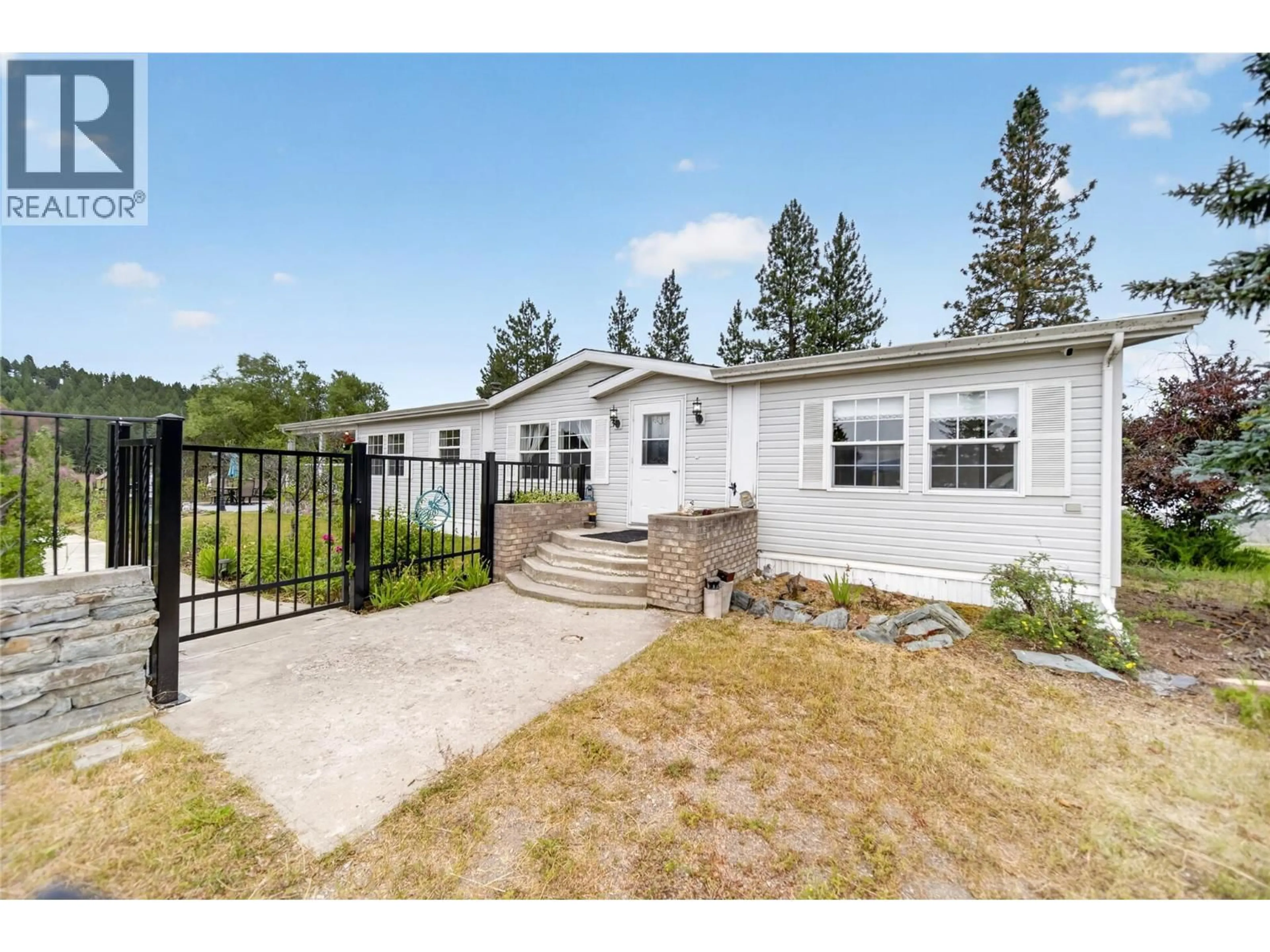 Home with vinyl exterior material, street for 3686 SWEET ROAD, Baynes Lake British Columbia V0B1T4