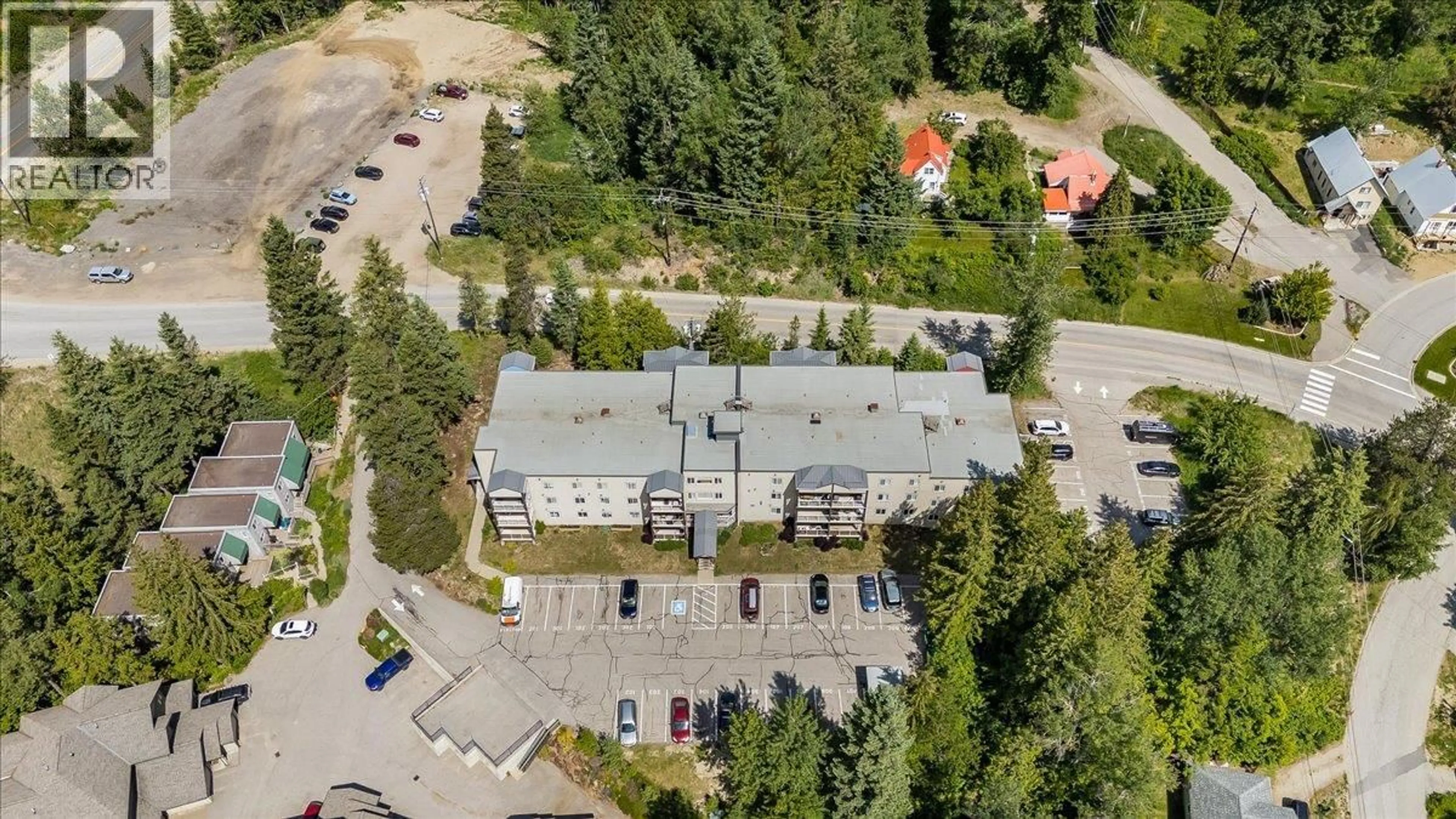 A pic from outside/outdoor area/front of a property/back of a property/a pic from drone, building for 207 - 1800 KIRKUP AVENUE, Rossland British Columbia V0G1Y0