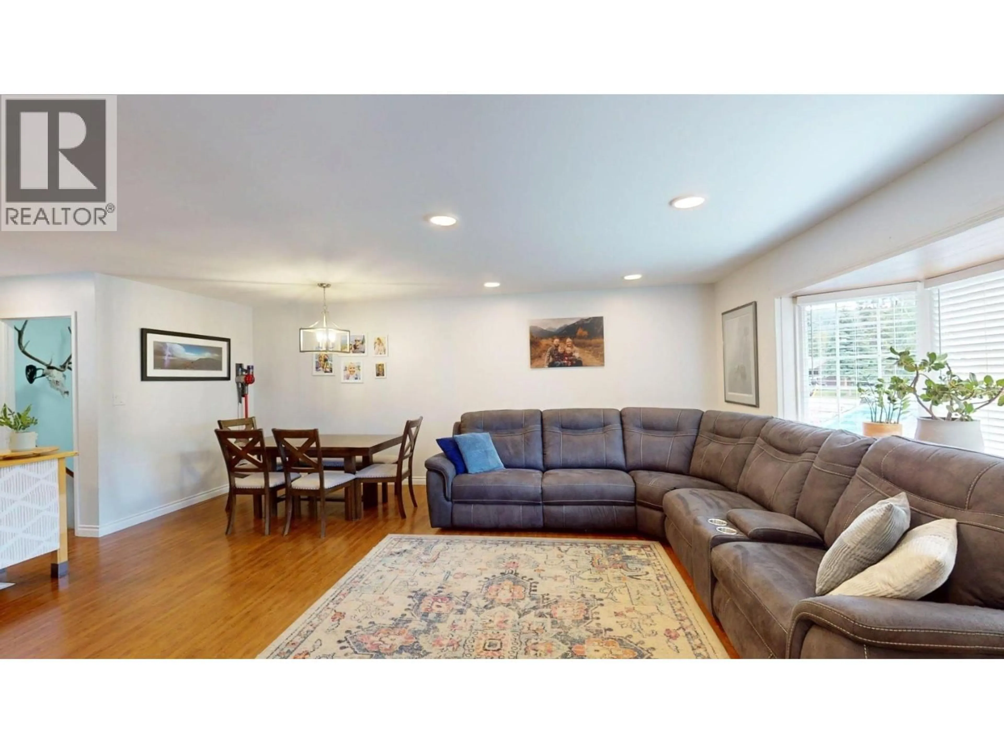 Living room with furniture, wood/laminate floor for 1165 NASHTON CRESCENT, Elkford British Columbia V0B1H0