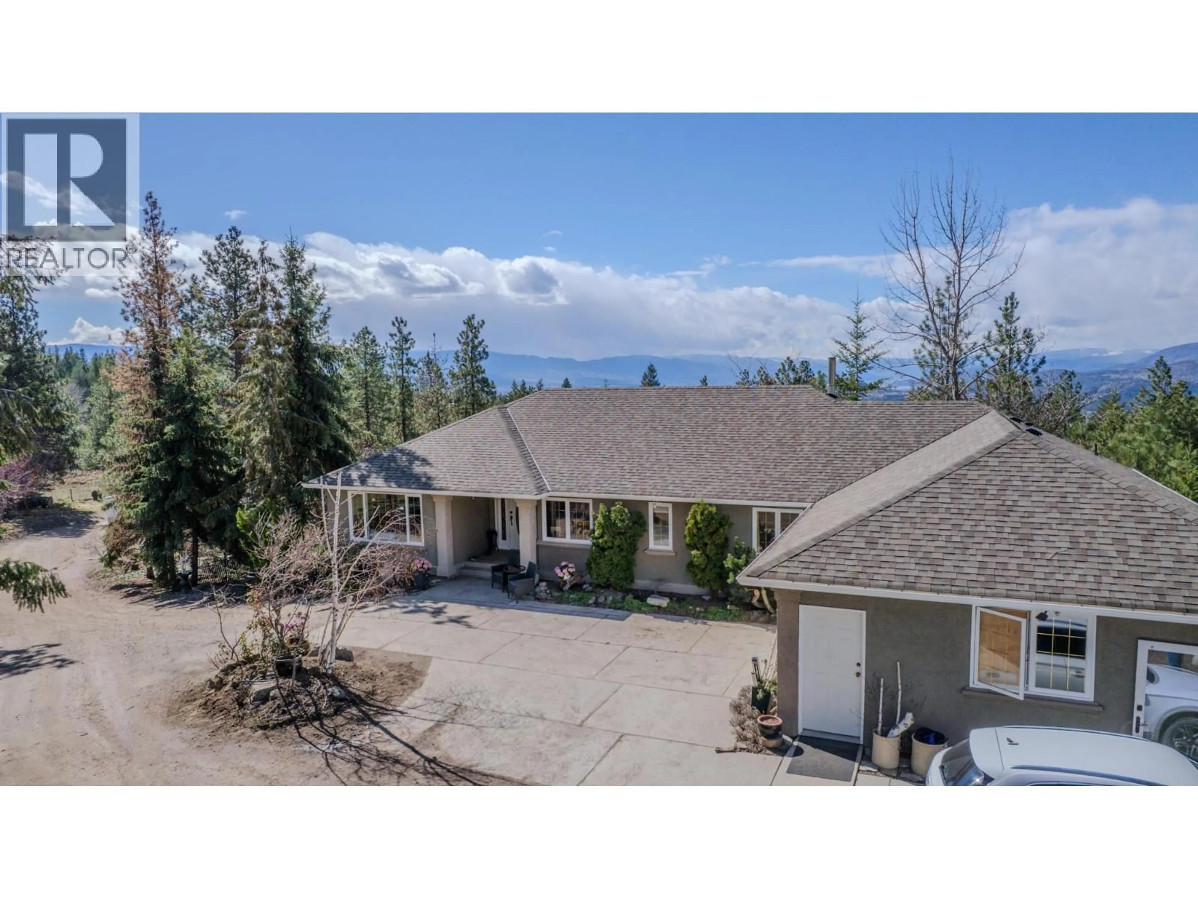 A pic from outside/outdoor area/front of a property/back of a property/a pic from drone, mountain view for 5775 DEADPINE DRIVE, Kelowna British Columbia V1P1A3