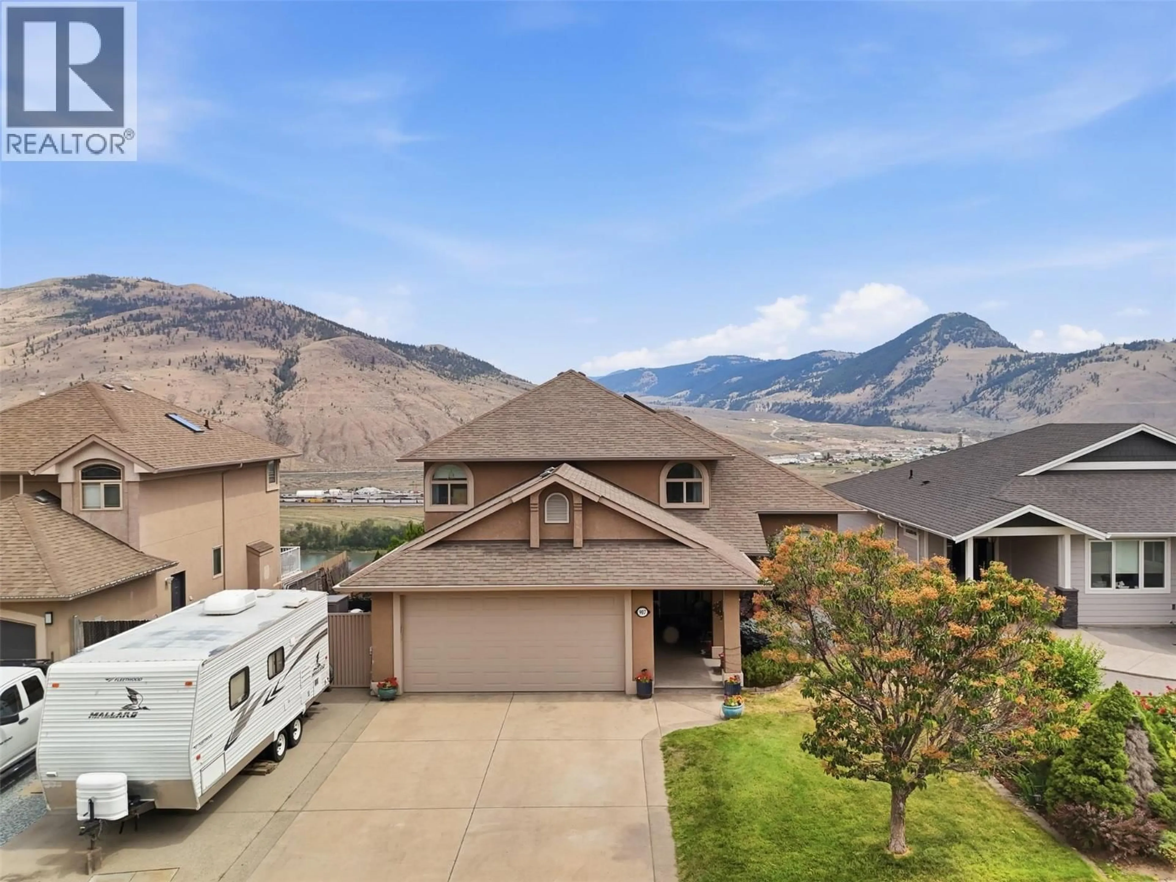 A pic from outside/outdoor area/front of a property/back of a property/a pic from drone, mountain view for 907 QUAIL DRIVE, Kamloops British Columbia V2B8N9