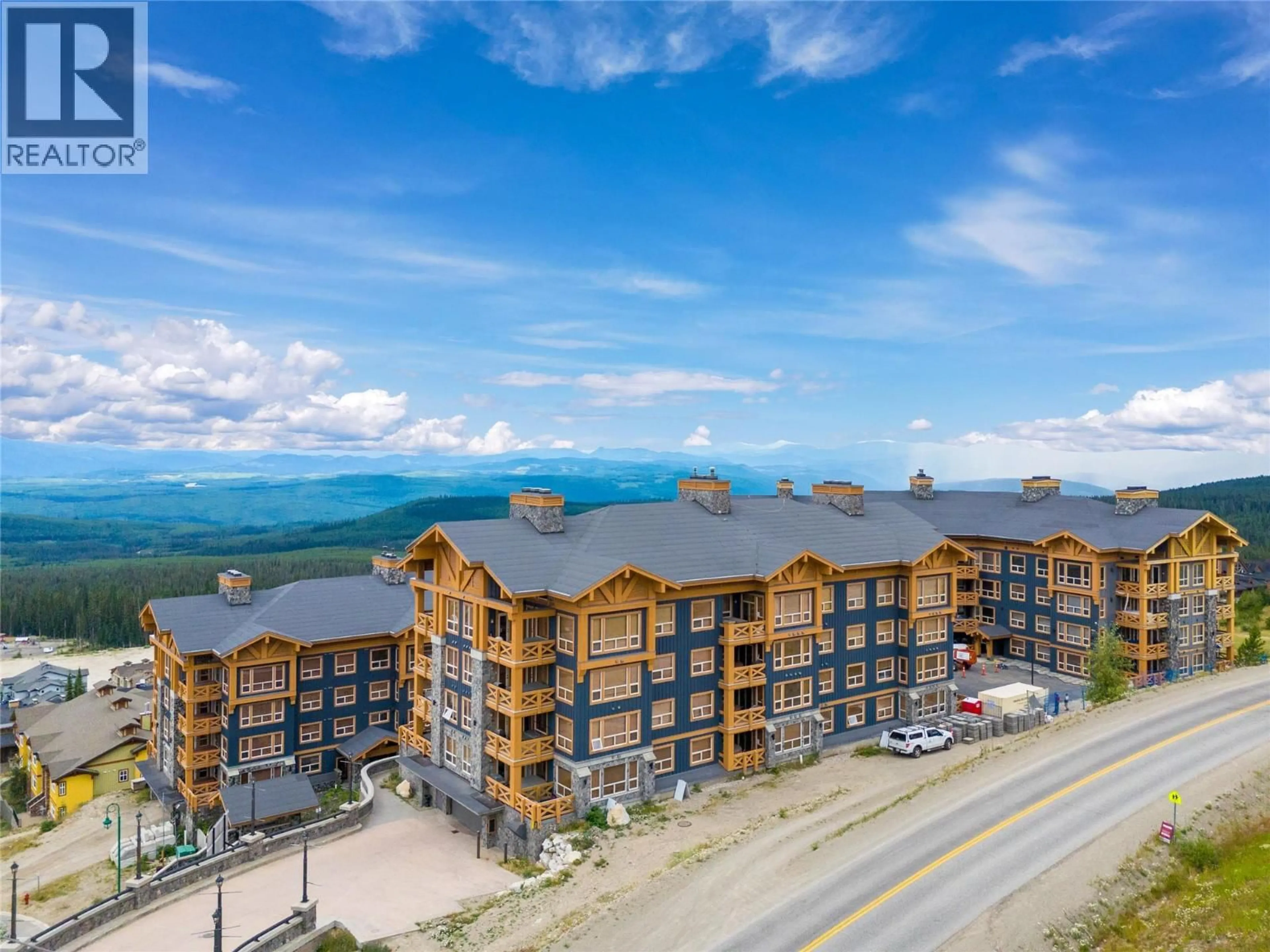 A pic from outside/outdoor area/front of a property/back of a property/a pic from drone, mountain view for 101 - 5300 BIG WHITE ROAD, Big White British Columbia V1P1P3