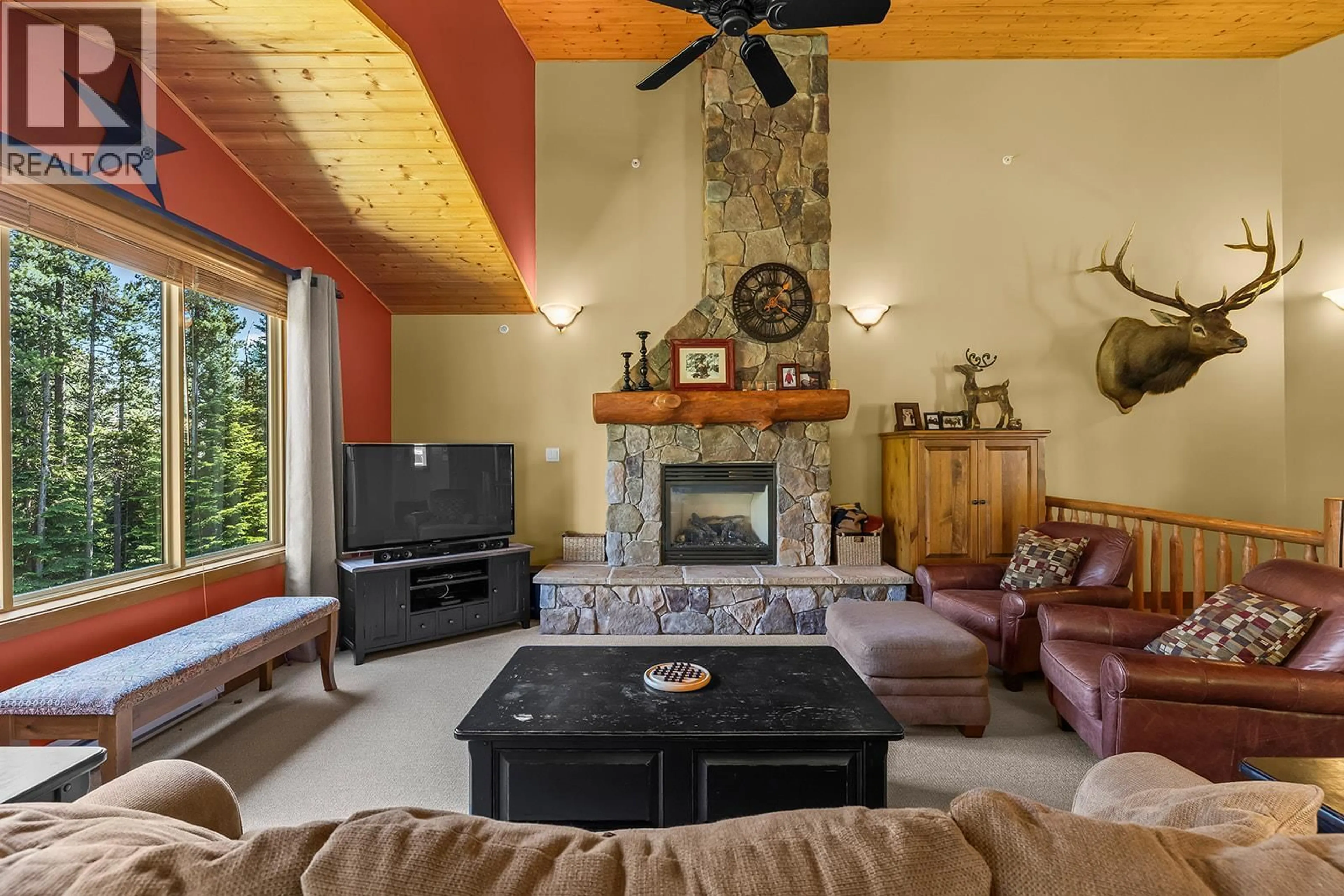 Living room with furniture, ceramic/tile floor for 11 - 5940 SNOW PINES WAY, Big White British Columbia V1P1P3