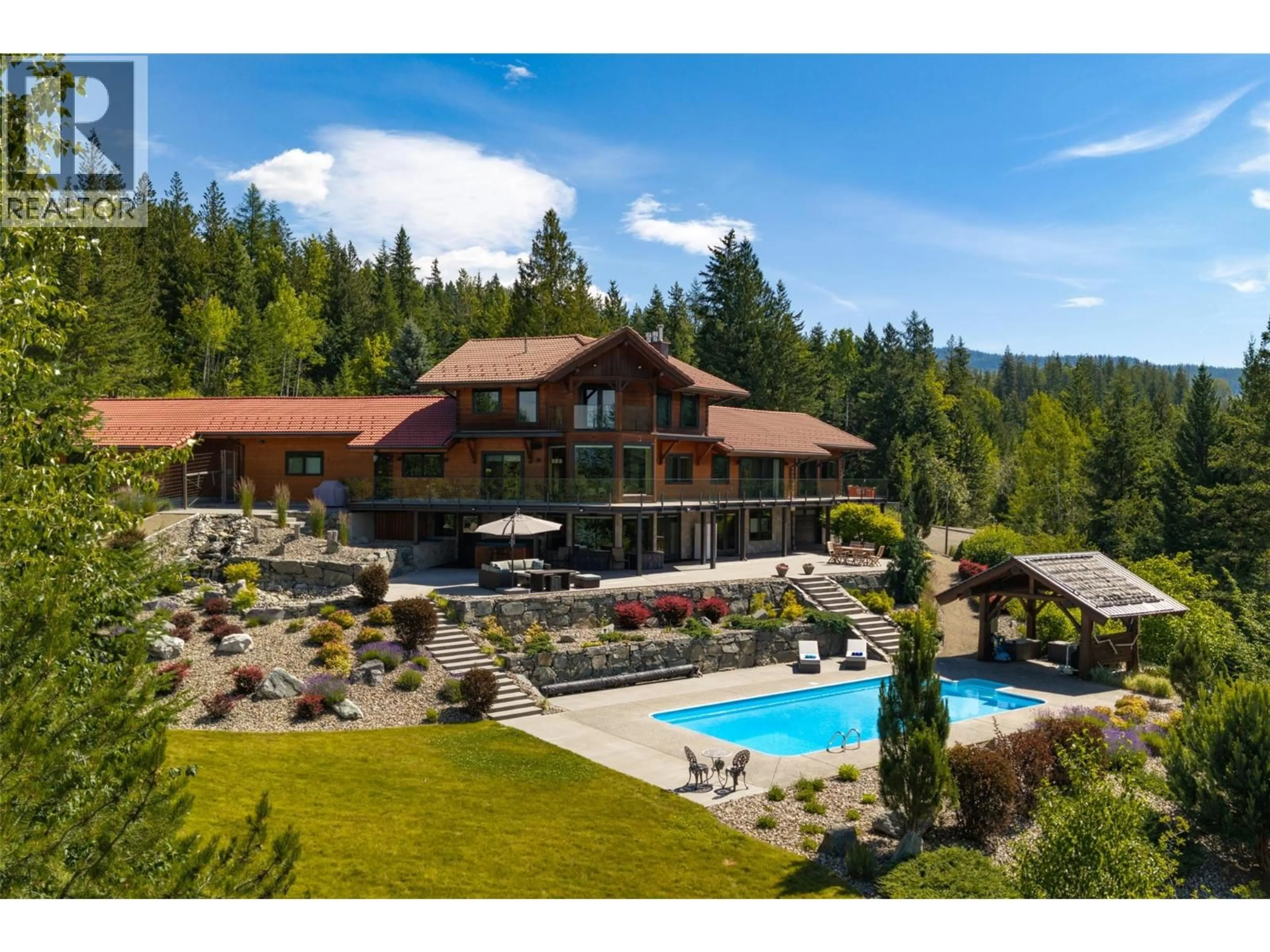 A pic from outside/outdoor area/front of a property/back of a property/a pic from drone, unknown for 8100/8104 SILVER STAR ROAD ROAD, Vernon British Columbia V1B3N1