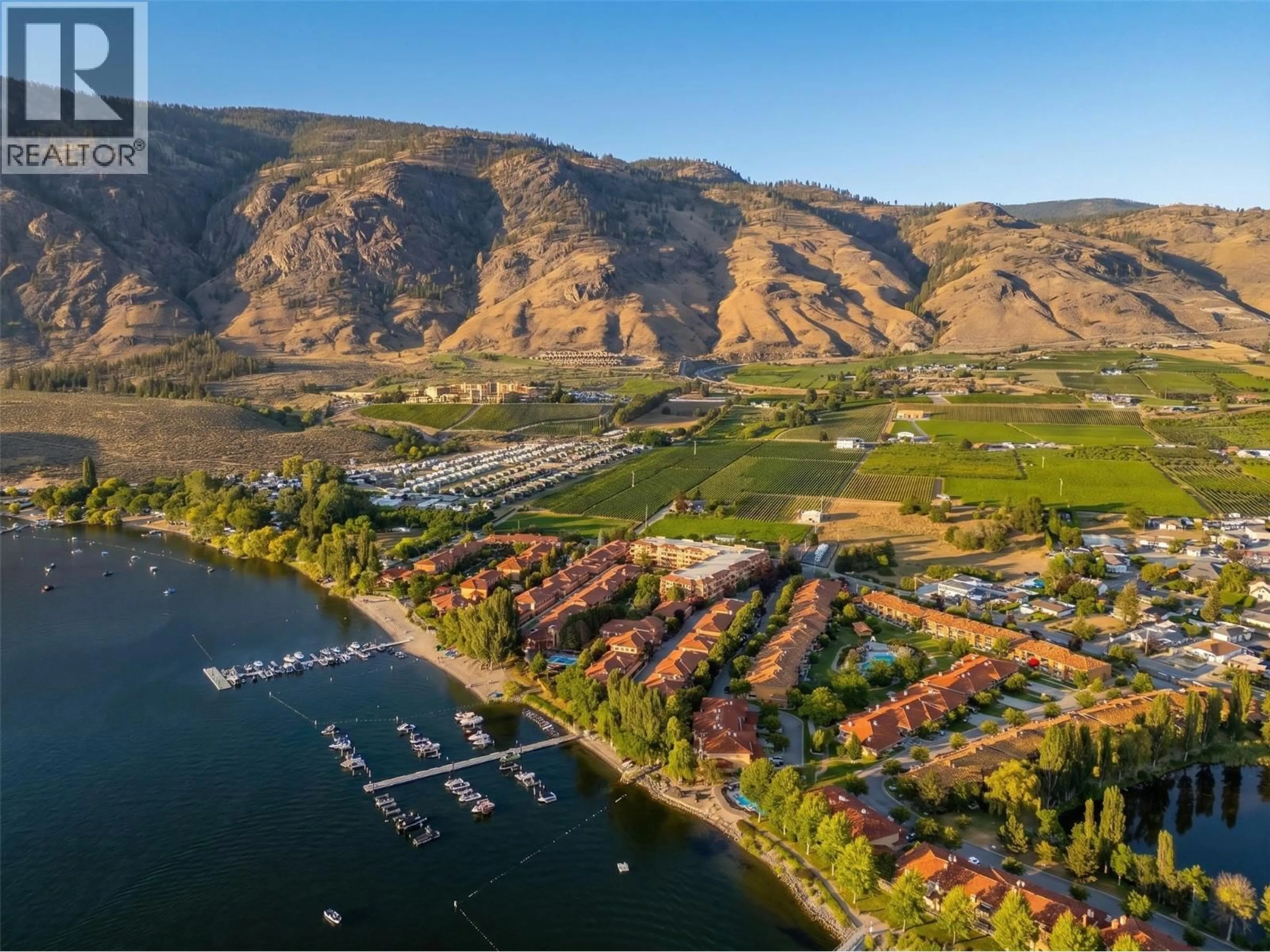 A pic from outside/outdoor area/front of a property/back of a property/a pic from drone, water/lake/river/ocean view for 118 - 7600 COTTONWOOD DRIVE, Osoyoos British Columbia V0H1V3