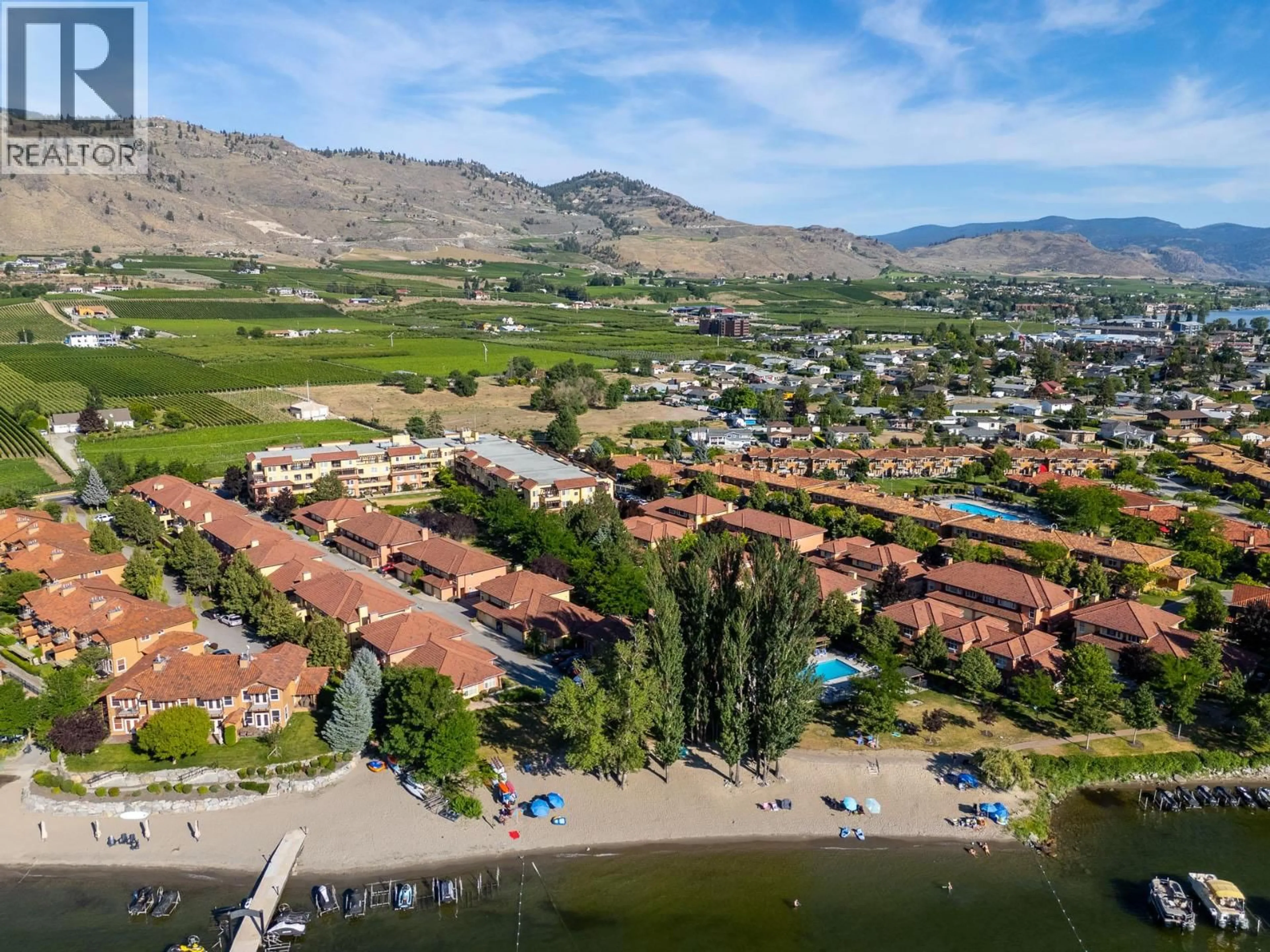 A pic from outside/outdoor area/front of a property/back of a property/a pic from drone, water/lake/river/ocean view for 118 - 7600 COTTONWOOD DRIVE, Osoyoos British Columbia V0H1V3