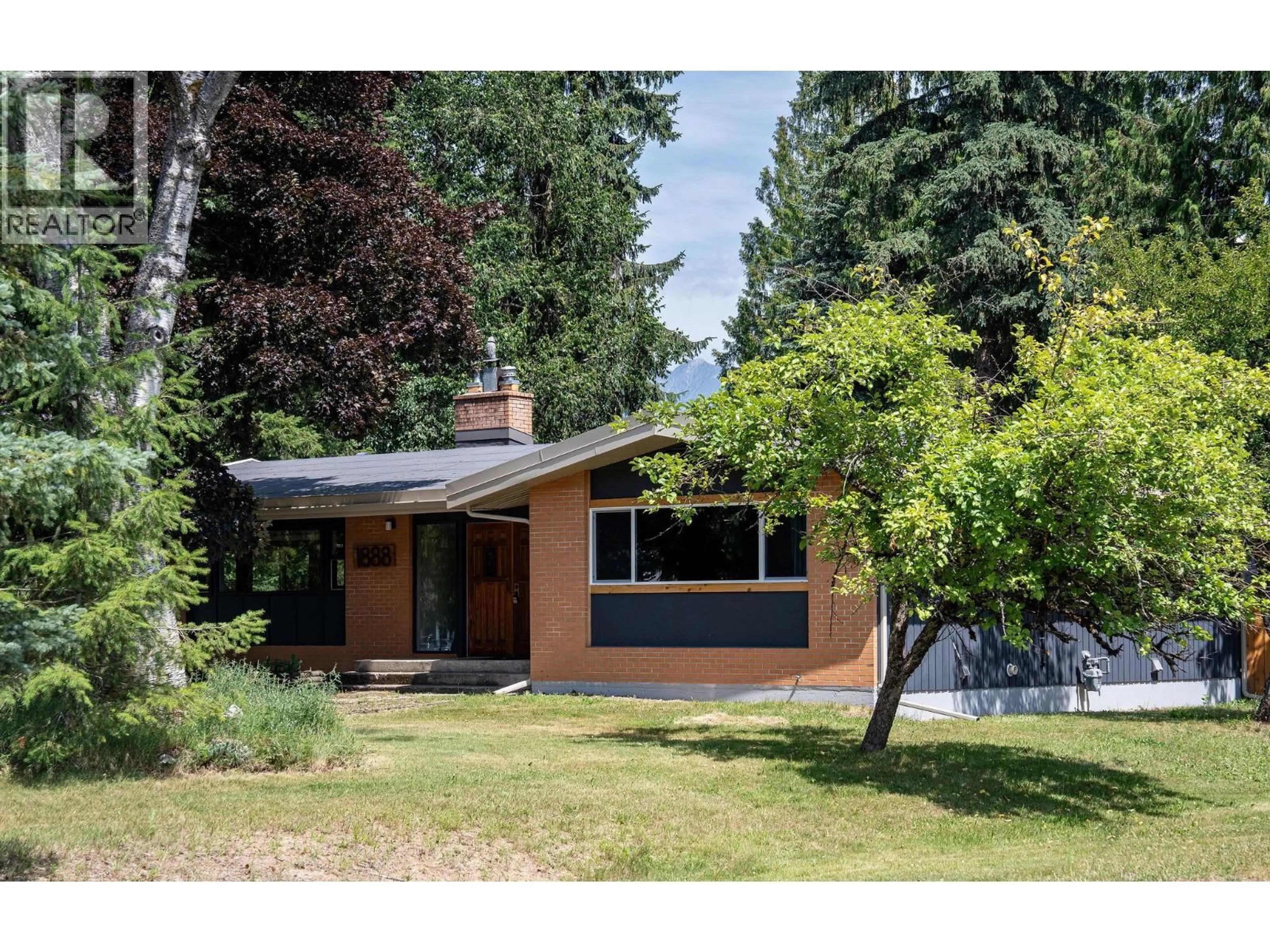 Home with vinyl exterior material, street for 1888 AIRPORT WAY, Revelstoke British Columbia V0E2S0