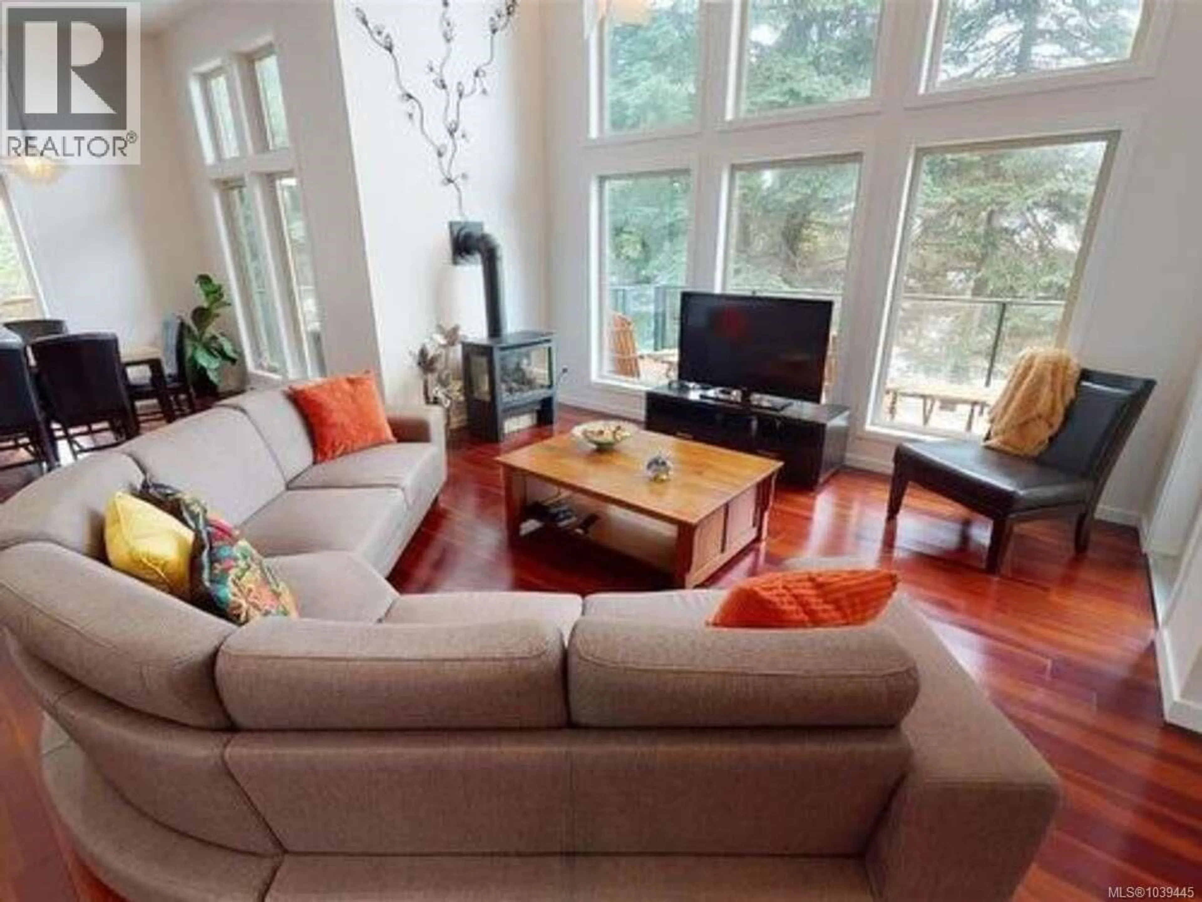 Living room with furniture, wood/laminate floor for 733 BERRY POINT ROAD, Gabriola Island British Columbia V0R1X1