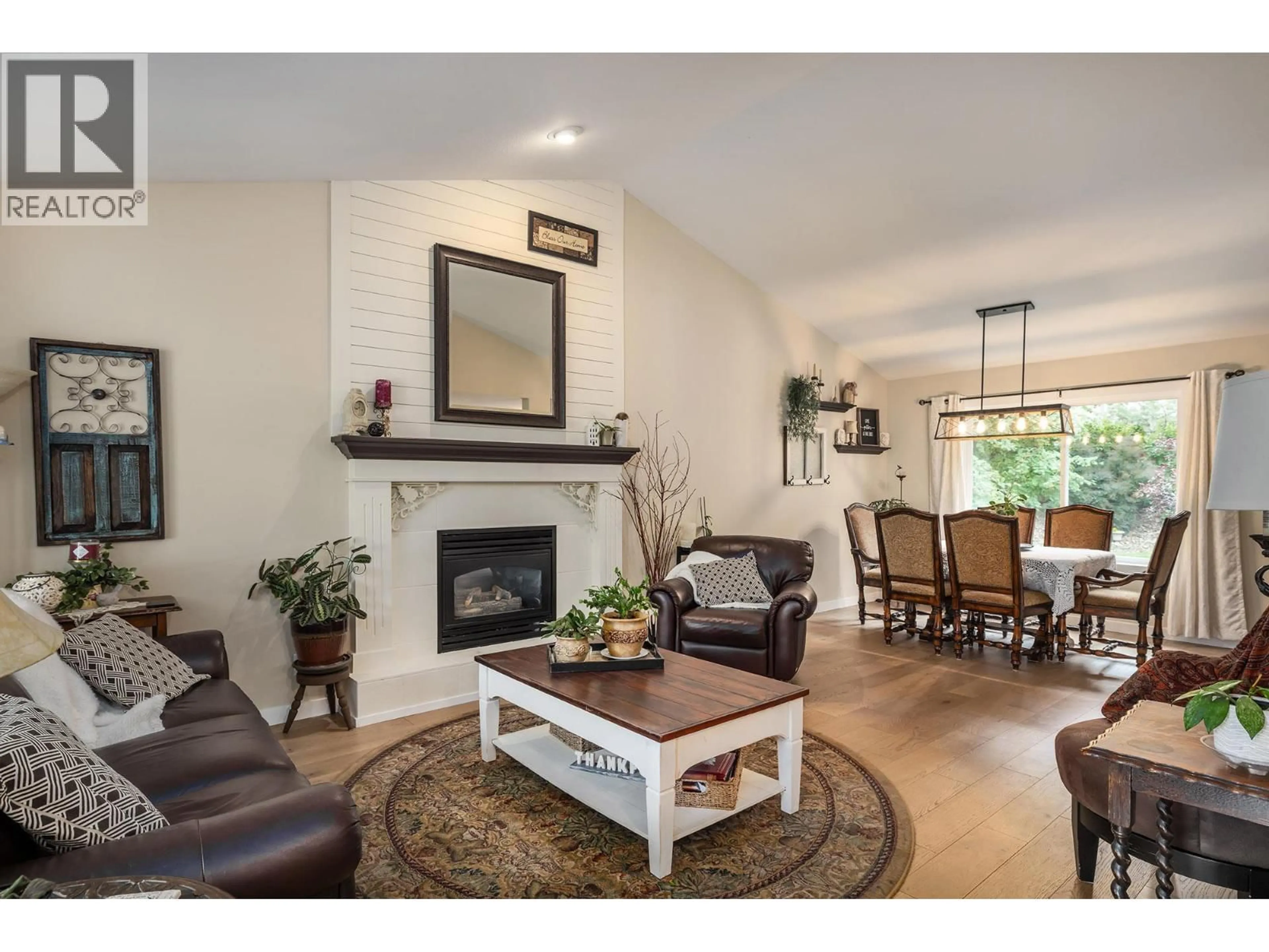 Living room with furniture, wood/laminate floor for 140 - 2220 SHANNON RIDGE DRIVE, West Kelowna British Columbia V4T2T6