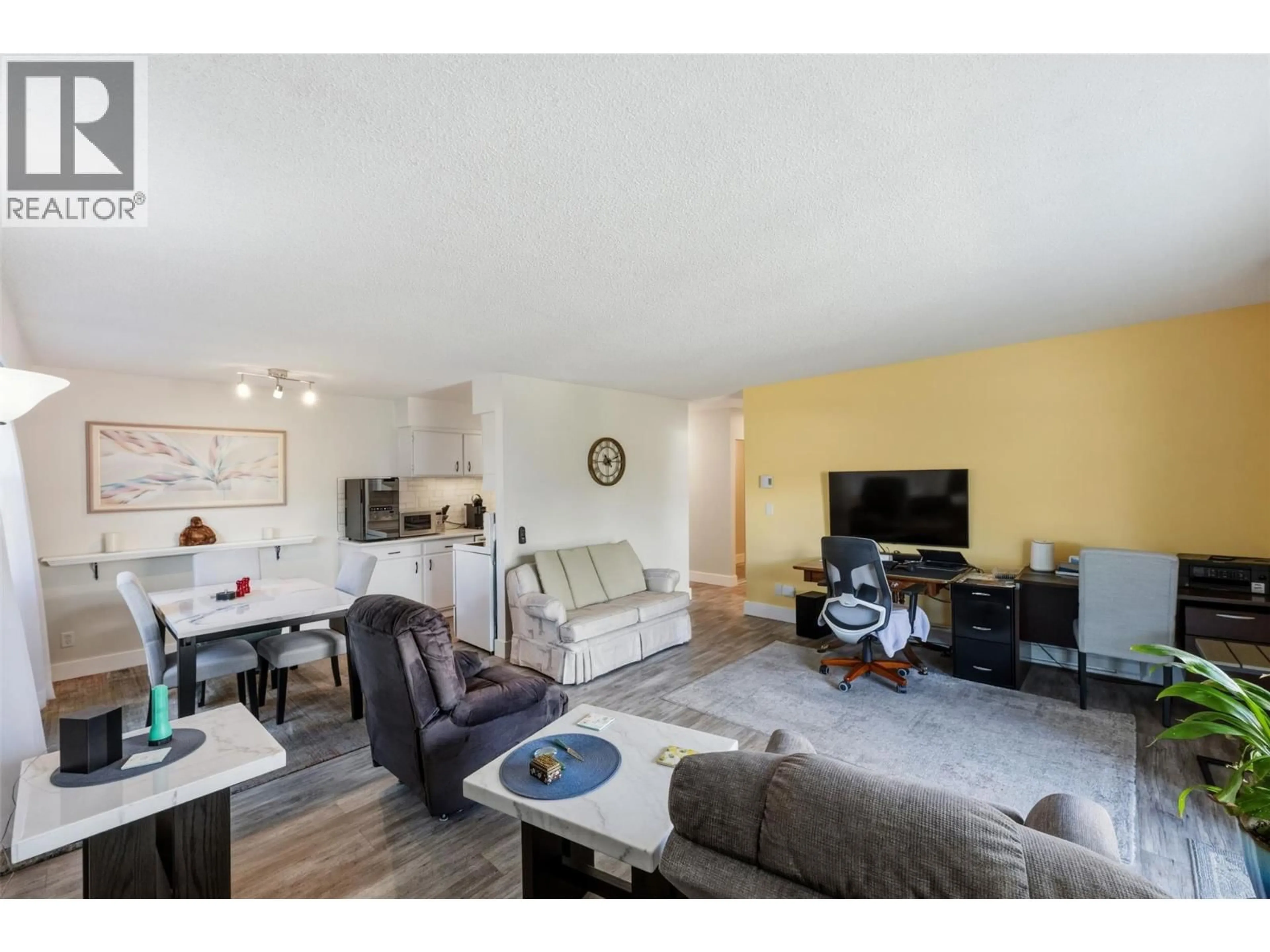 Living room with furniture, wood/laminate floor for 106 - 22 ABBOTT STREET, Penticton British Columbia V2A4J2