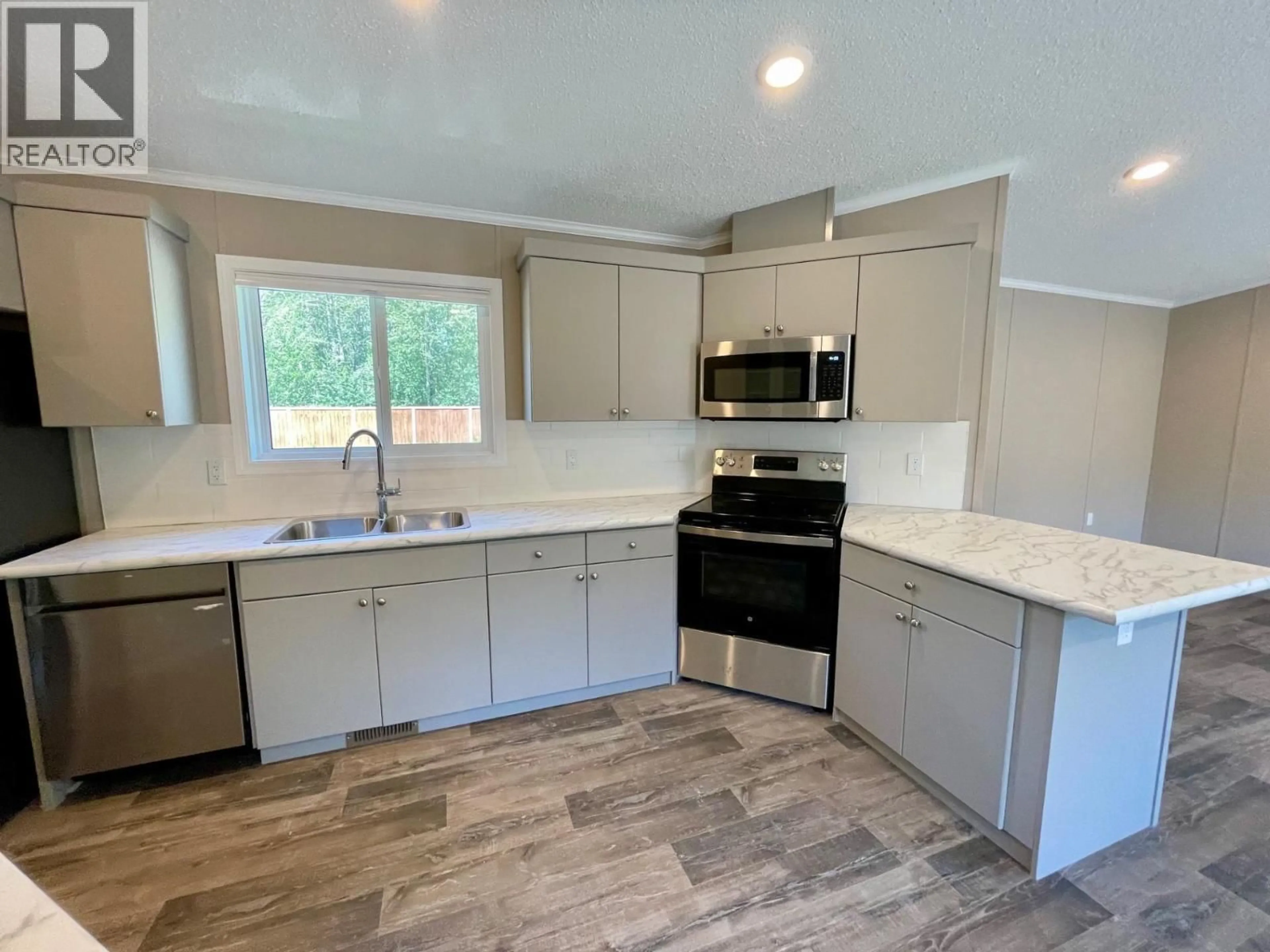 Open concept kitchen, ceramic/tile floor for 47 - 100 ASPEN DRIVE, Sparwood British Columbia V0B2G0
