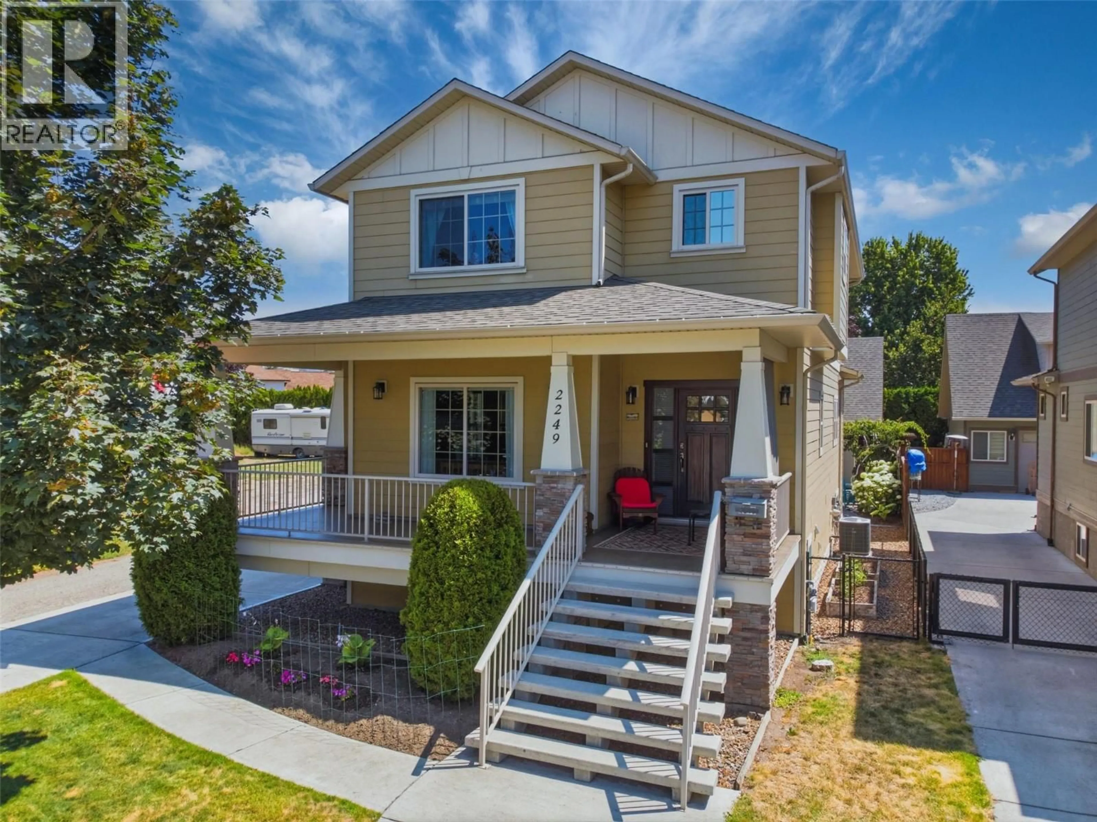 Home with vinyl exterior material, street for 2249 WILKINSON STREET, Kelowna British Columbia V1Y7Z1