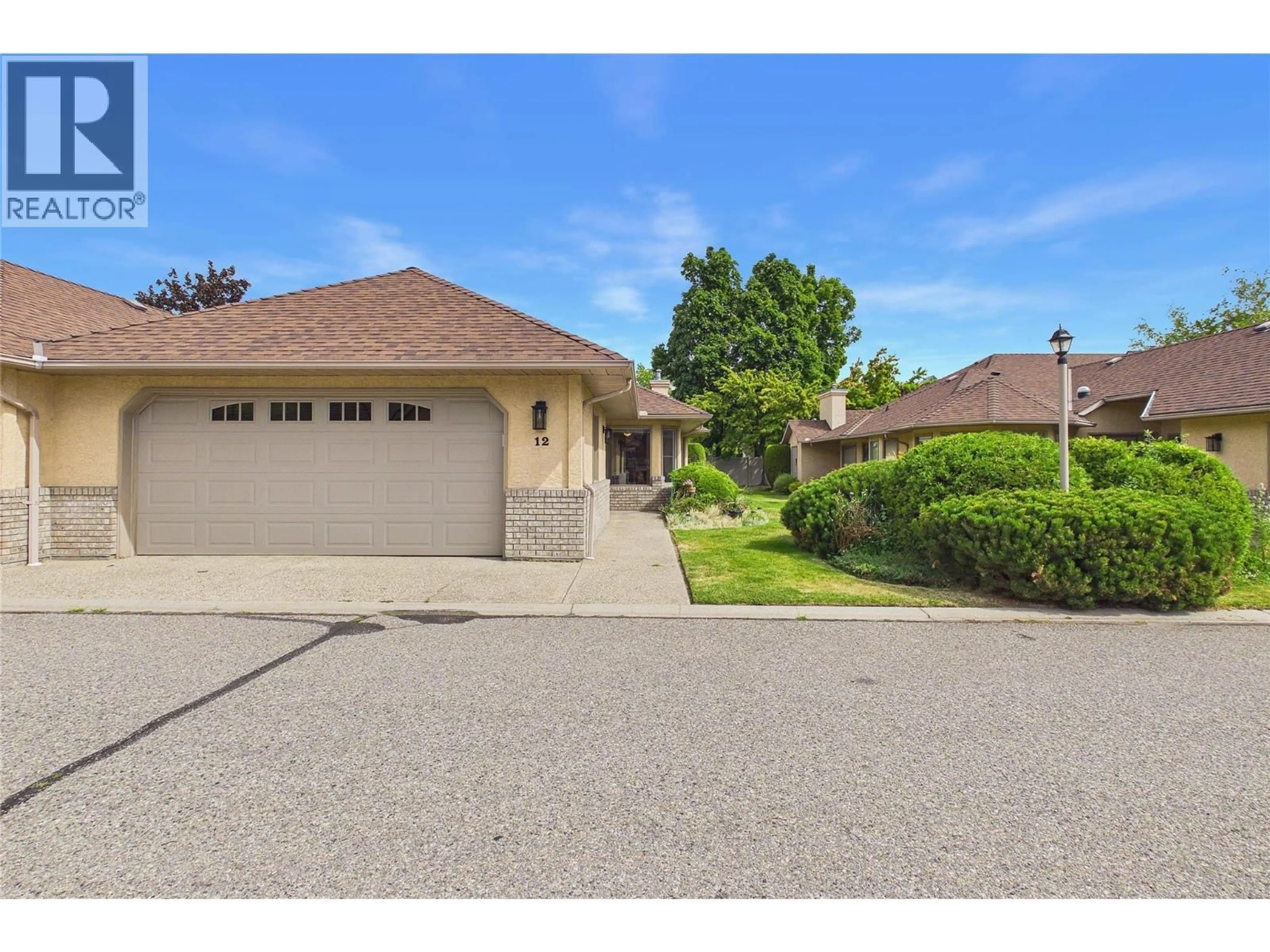 A pic from outside/outdoor area/front of a property/back of a property/a pic from drone, street for 12 - 860 LANFRANCO ROAD, Kelowna British Columbia V1W3W9