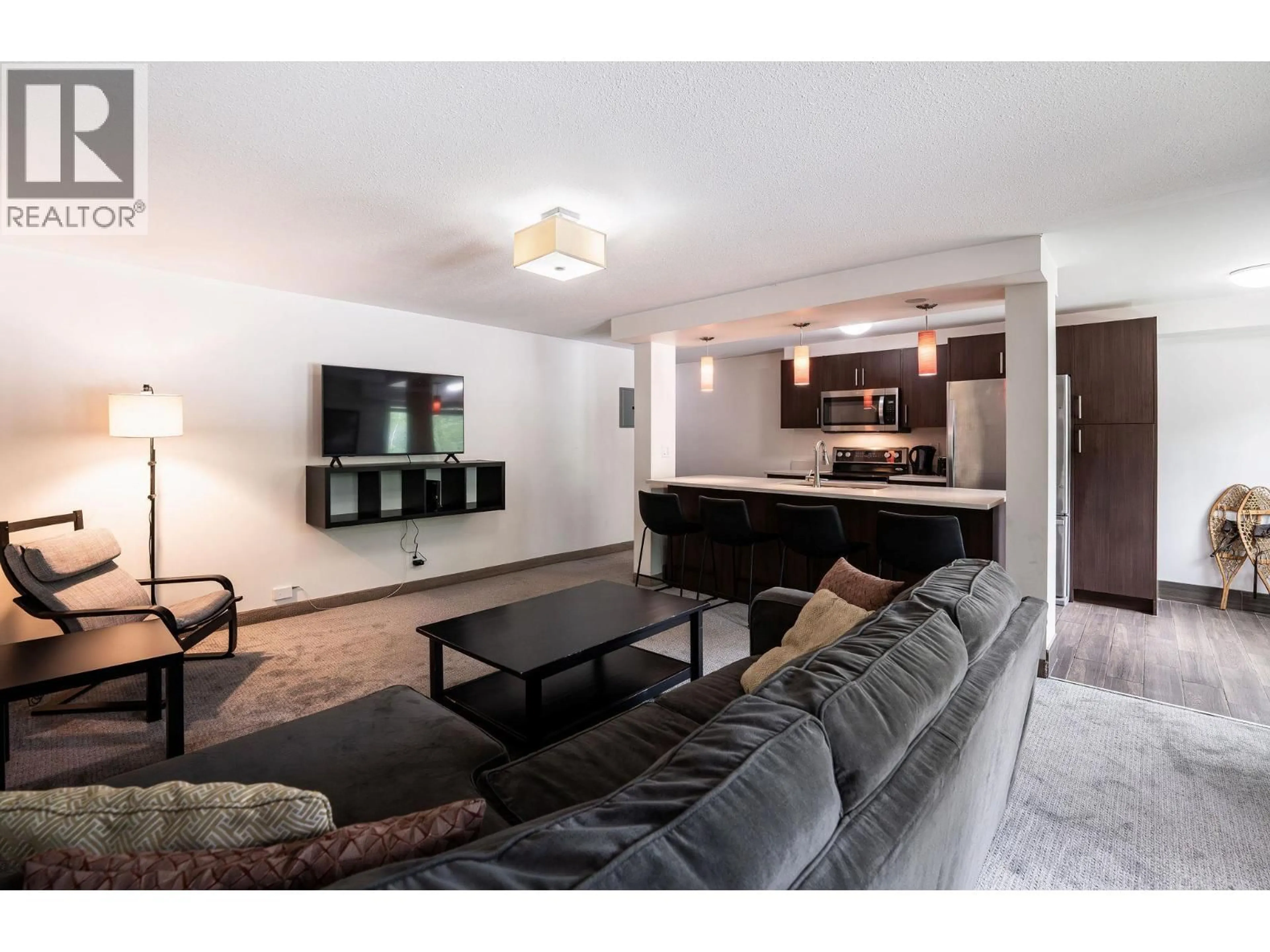 Living room with furniture, unknown for 104 - 1211 VICTORIA ROAD WEST, Revelstoke British Columbia V0E2S0
