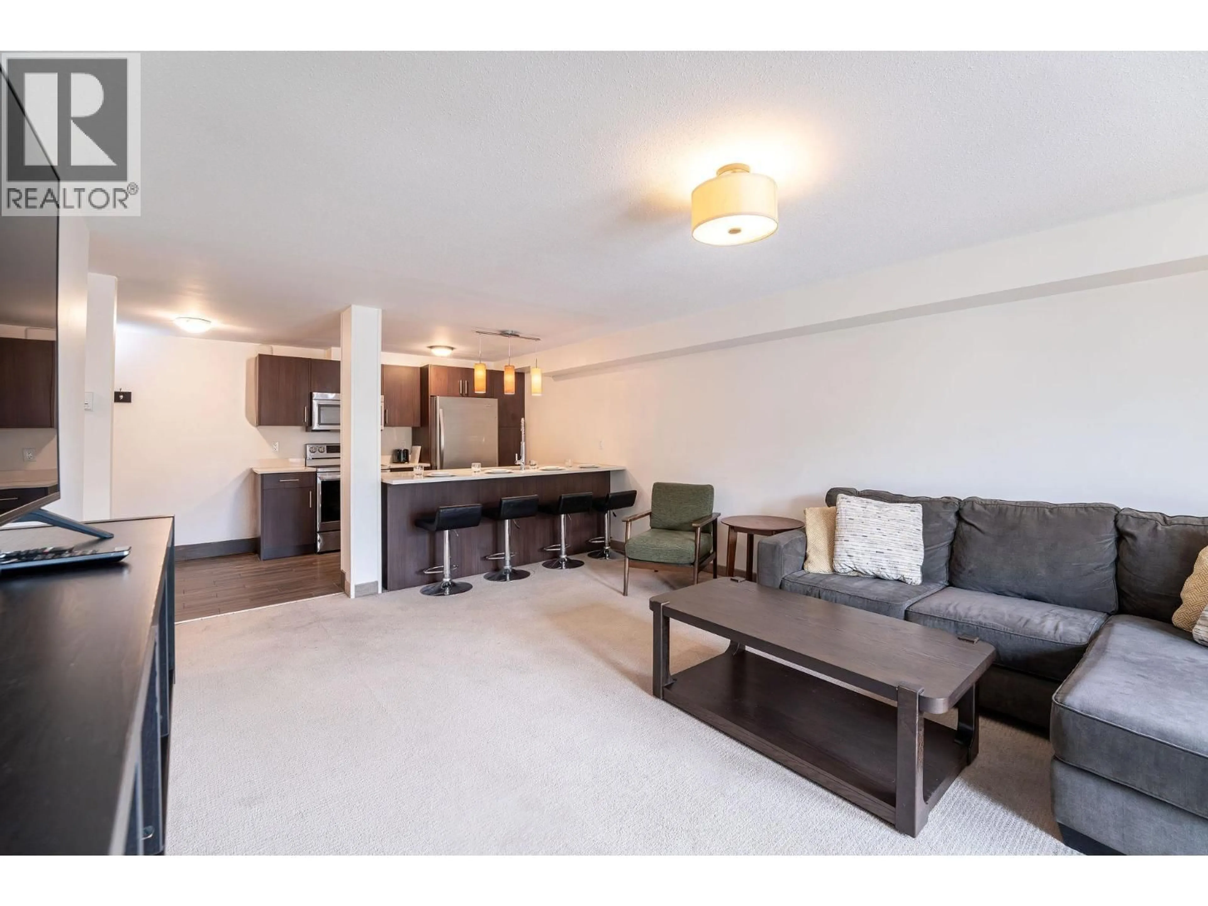 Living room with furniture, unknown for 203 - 1211 VICTORIA ROAD WEST, Revelstoke British Columbia V0E2S0