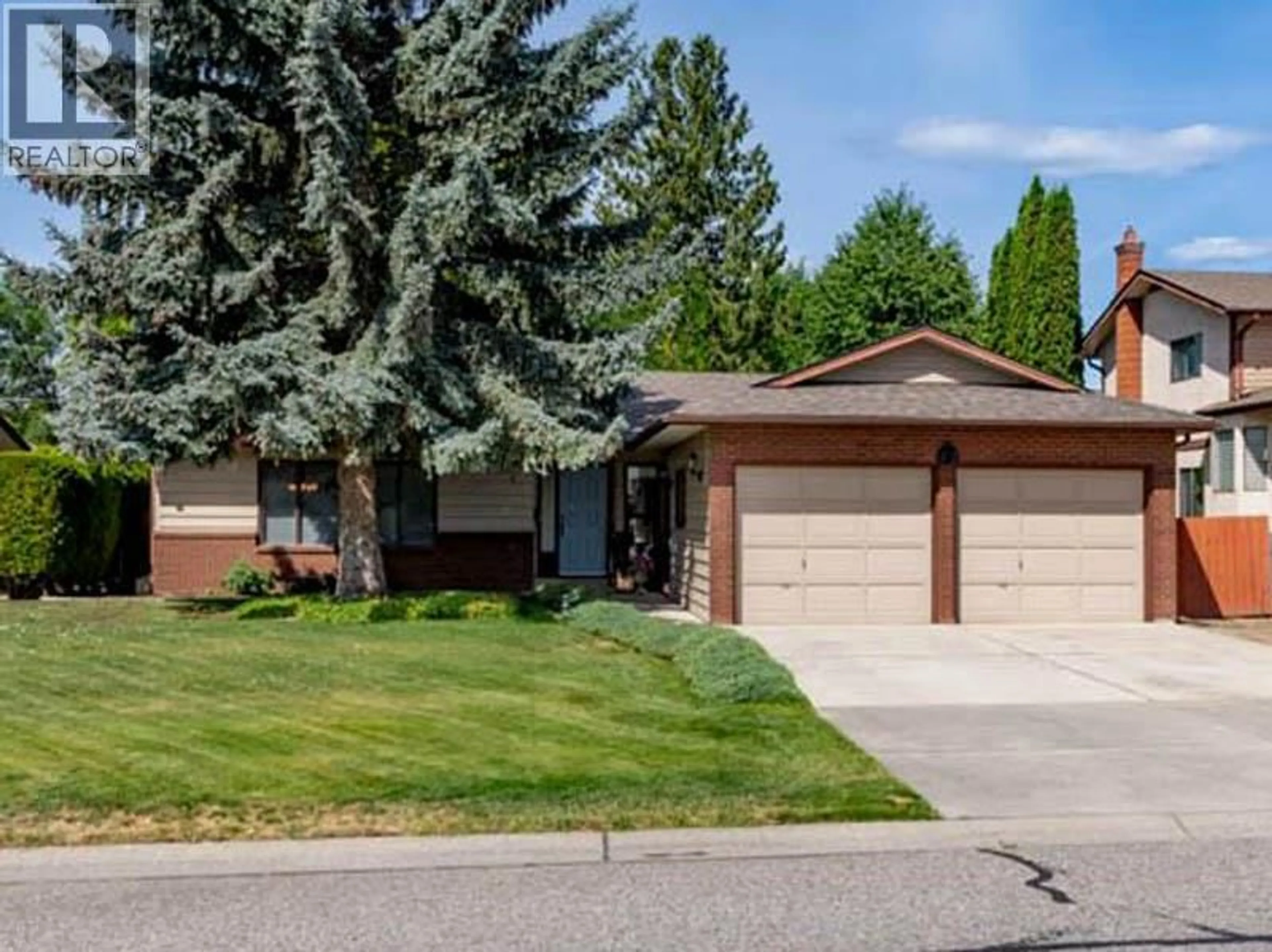 Home with vinyl exterior material, street for 2434 RHONDDA CRESCENT, Kelowna British Columbia V1Y8A3