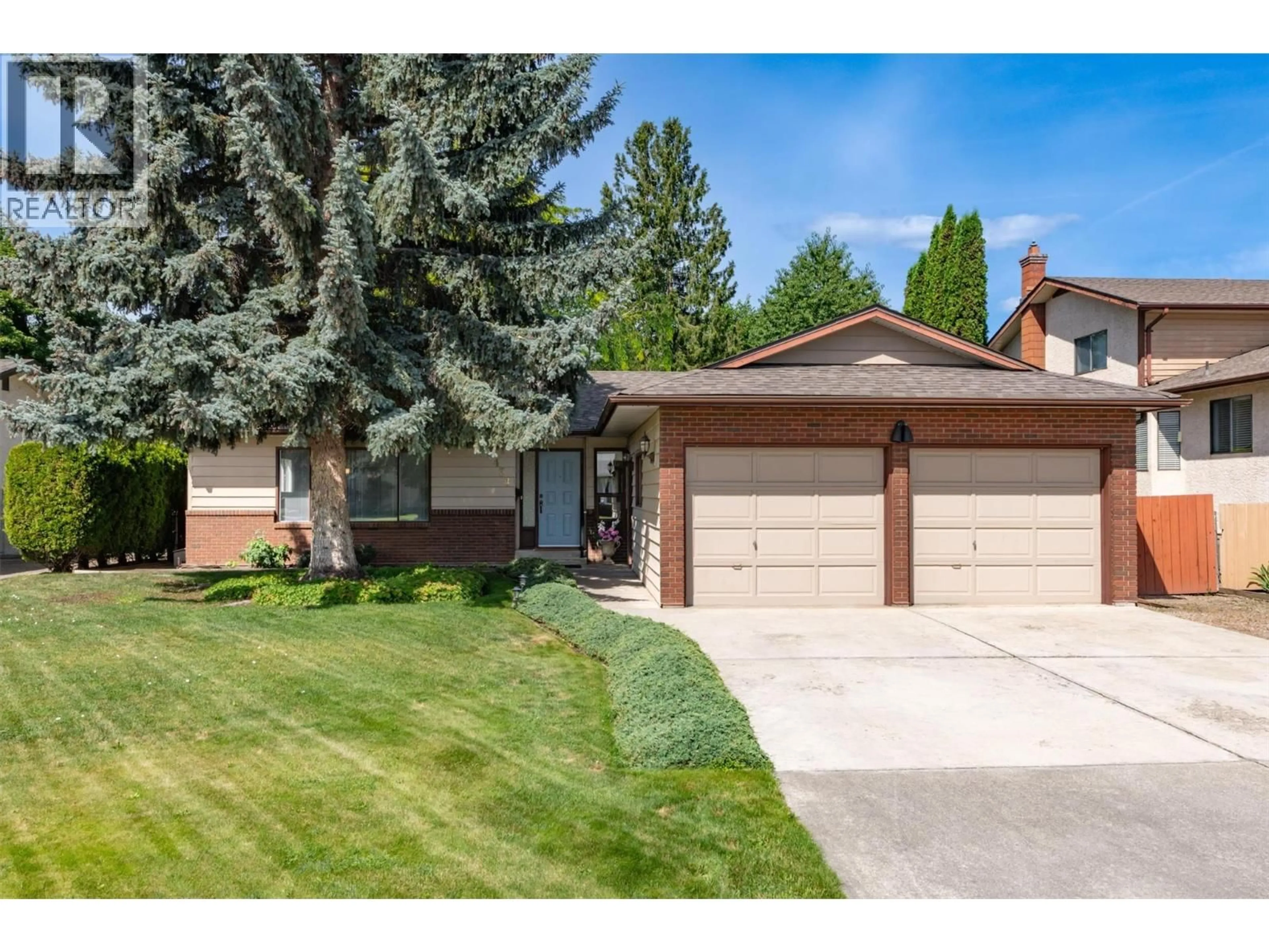 Home with vinyl exterior material, street for 2434 RHONDDA CRESCENT, Kelowna British Columbia V1Y8A3