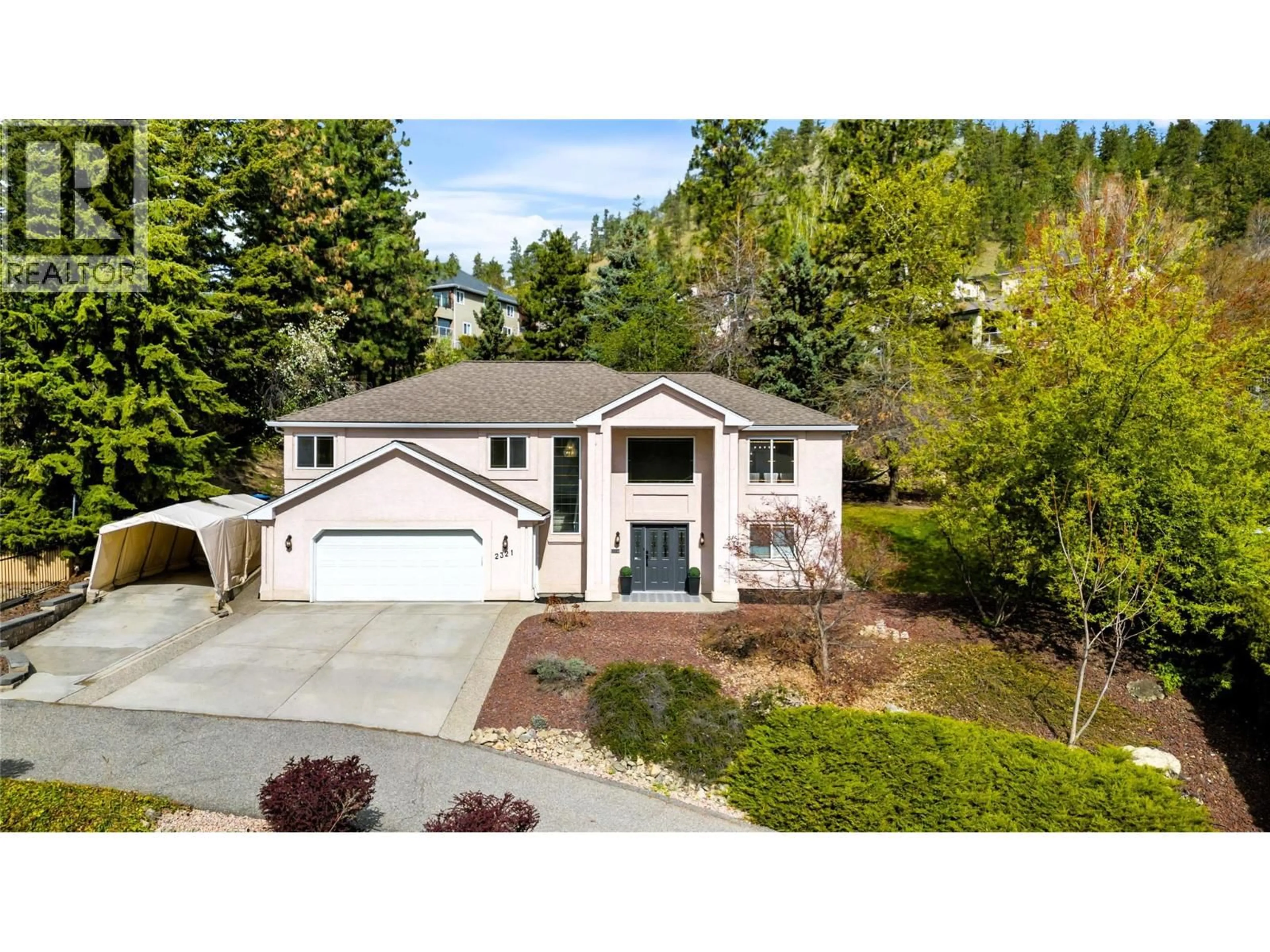 Home with vinyl exterior material, street for 2321 LILLOOET CRESCENT, Kelowna British Columbia V1V1T1
