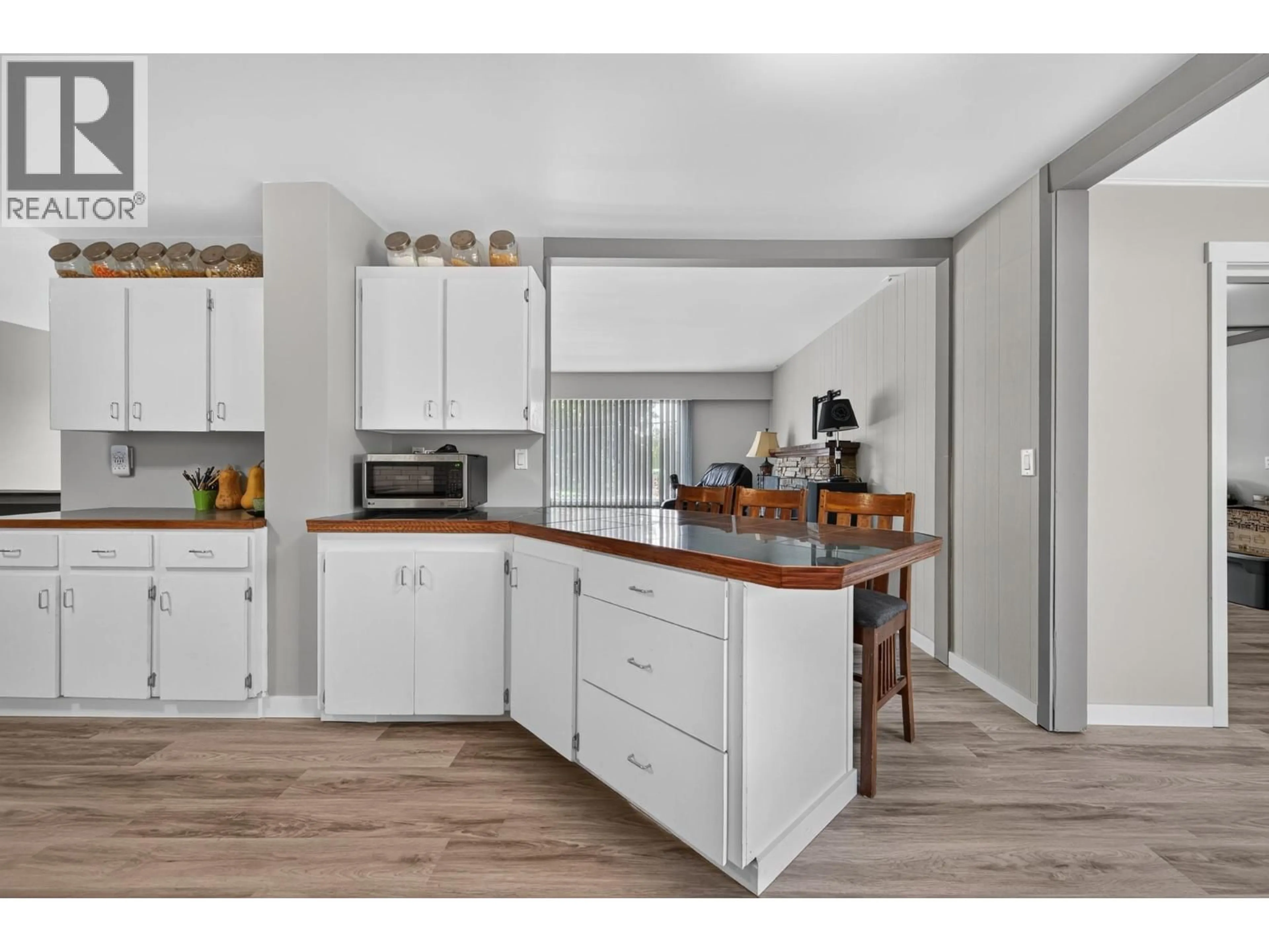 Open concept kitchen, wood/laminate floor for 816 BEBEK ROAD, Kamloops British Columbia V2B6P1