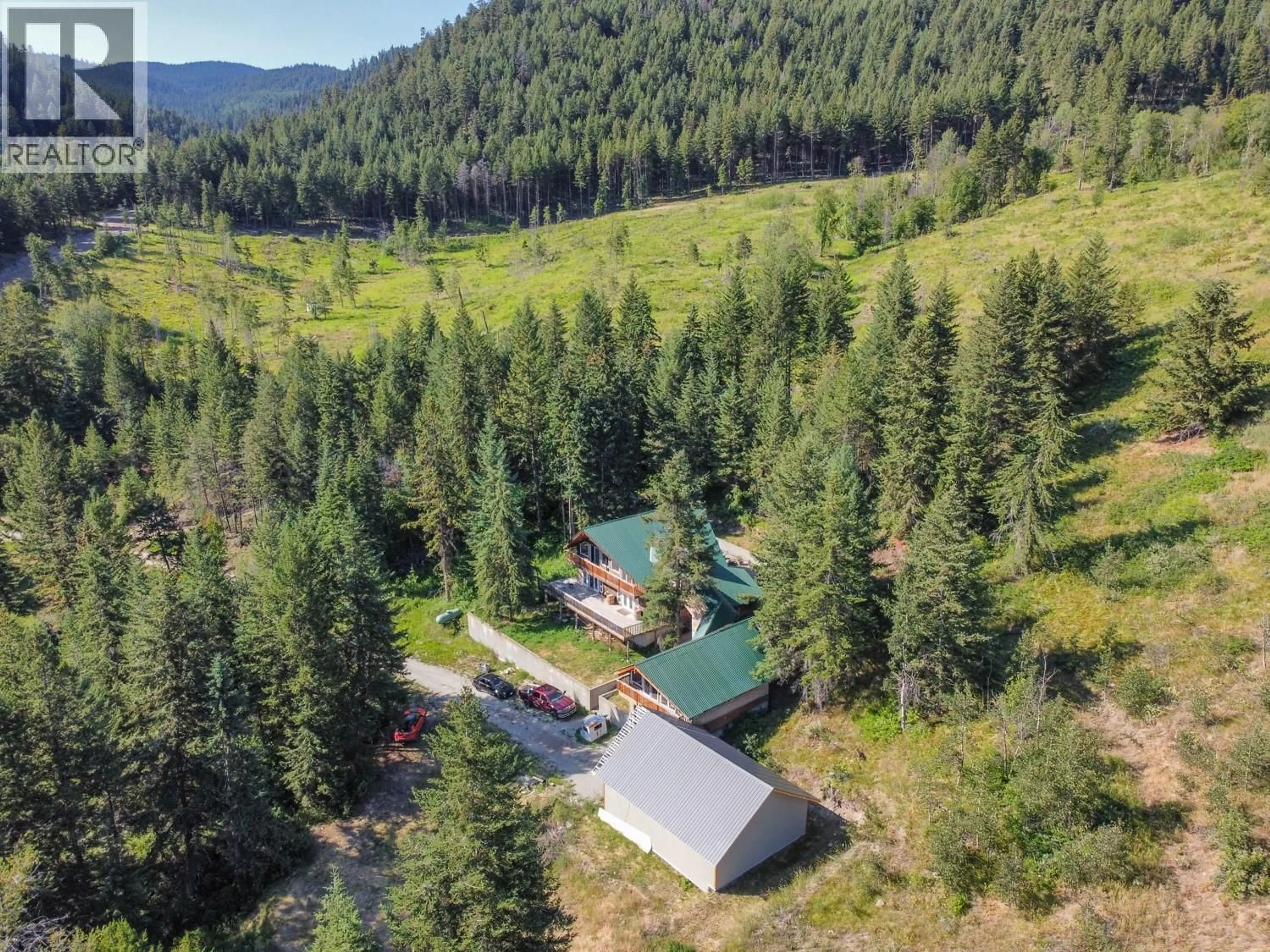 A pic from outside/outdoor area/front of a property/back of a property/a pic from drone, forest/trees view for 842 GRAND ORO ROAD, Kaleden British Columbia V0H1K0