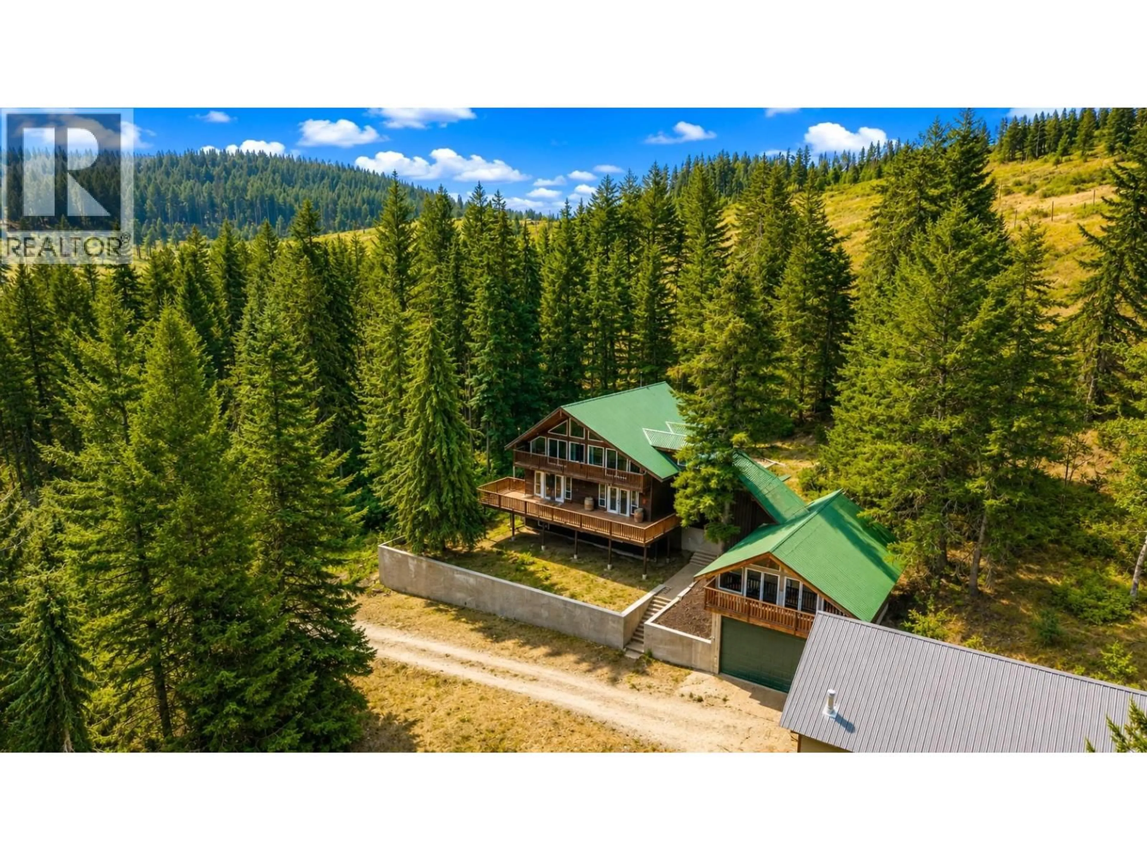 A pic from outside/outdoor area/front of a property/back of a property/a pic from drone, forest/trees view for 842 GRAND ORO ROAD, Kaleden British Columbia V0H1K0
