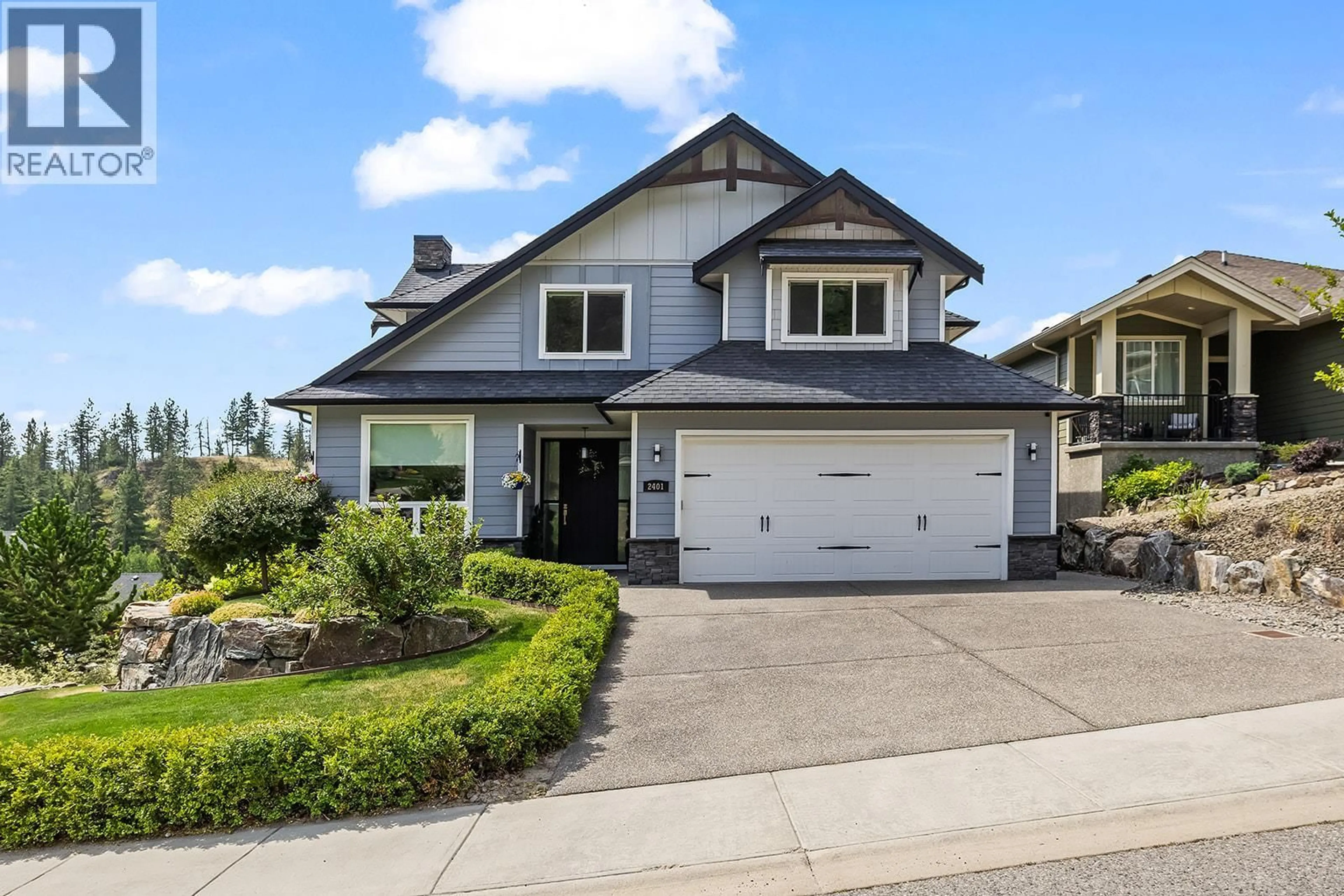 Home with vinyl exterior material, street for 2401 TALLUS HEIGHTS DRIVE, West Kelowna British Columbia V4T3M2
