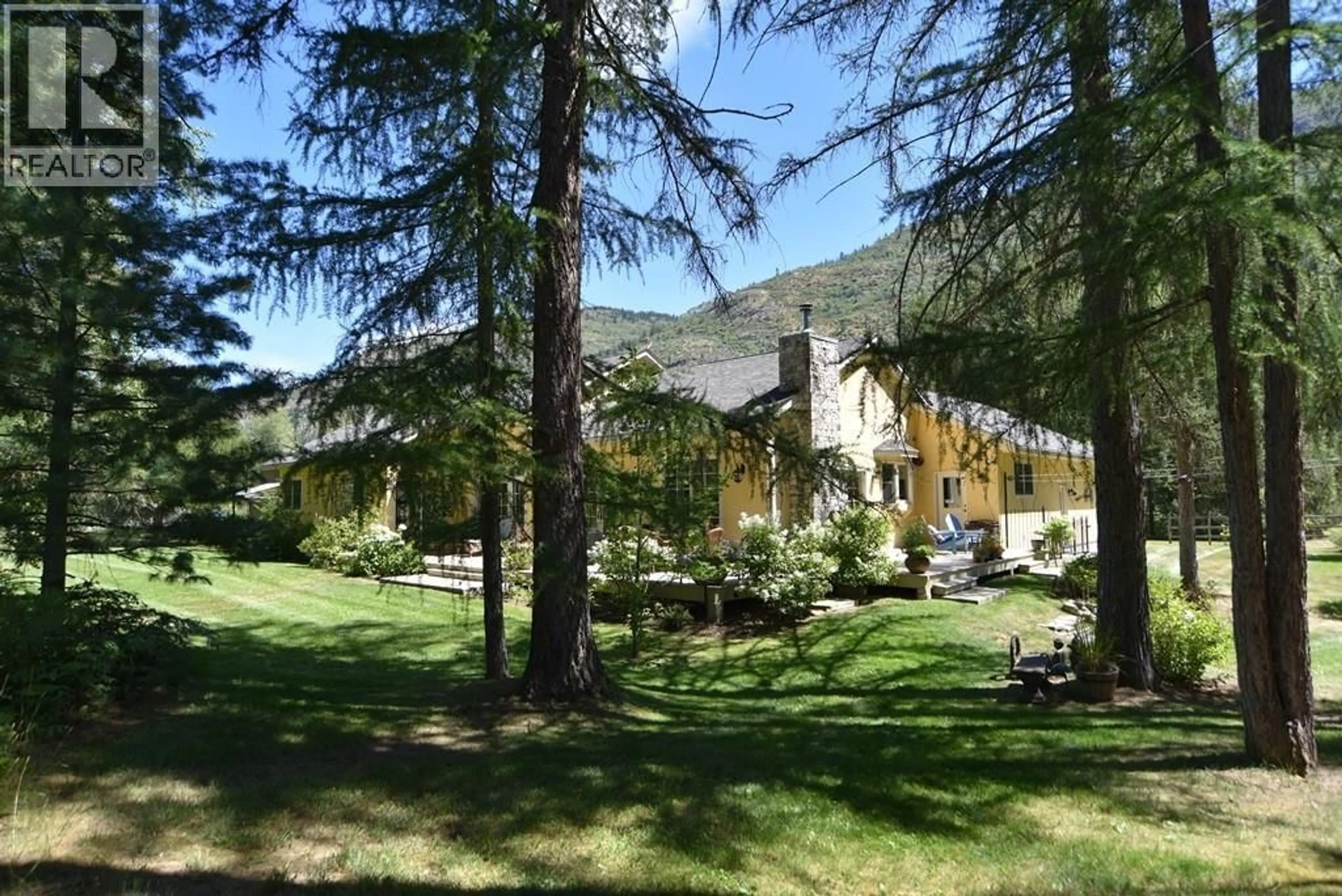 A pic from outside/outdoor area/front of a property/back of a property/a pic from drone, mountain view for 9309 STATION ROAD, Trail British Columbia V1R4W6