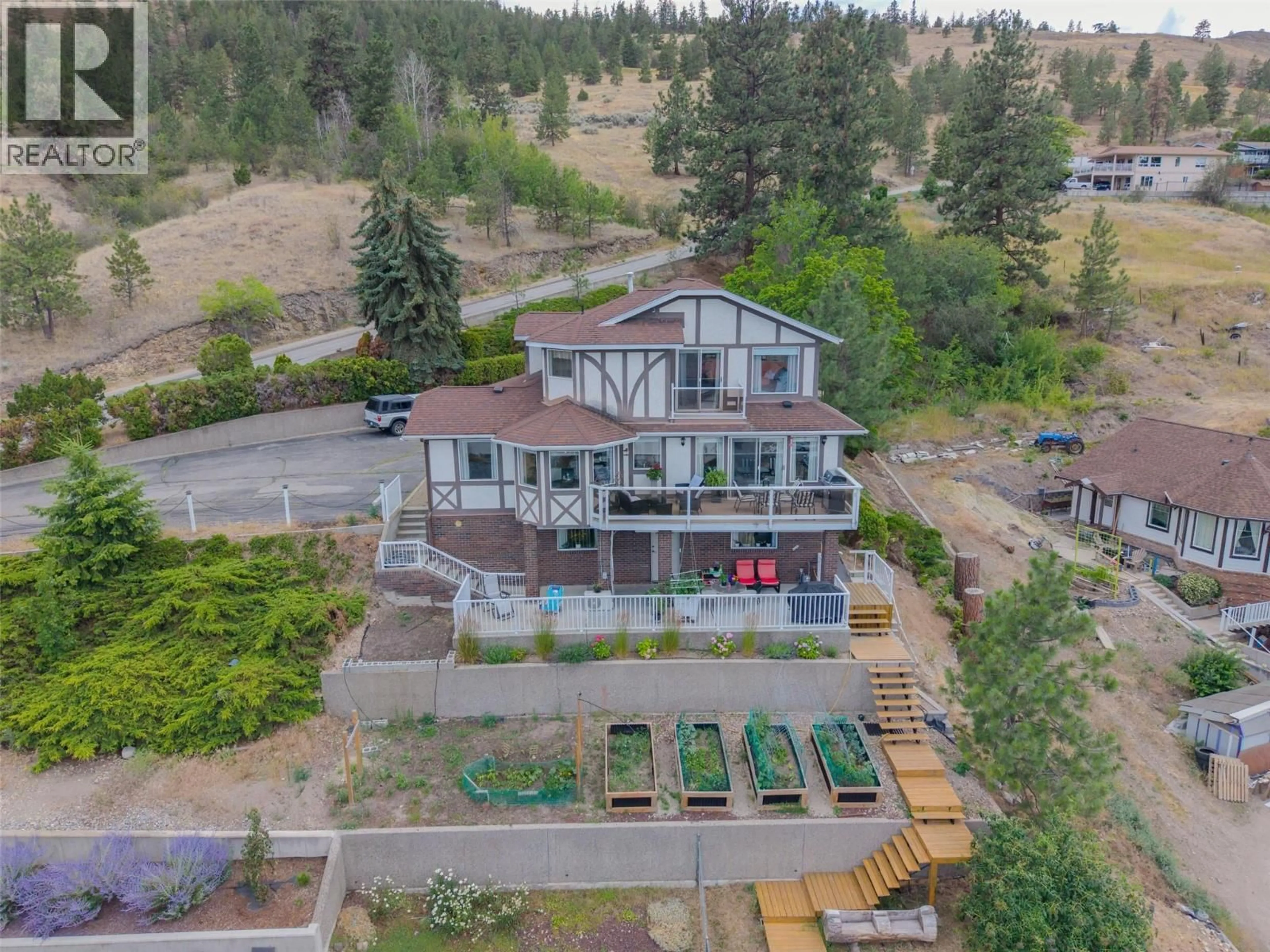 A pic from outside/outdoor area/front of a property/back of a property/a pic from drone, unknown for 8188 MILNE ROAD, Summerland British Columbia V0H1Z7