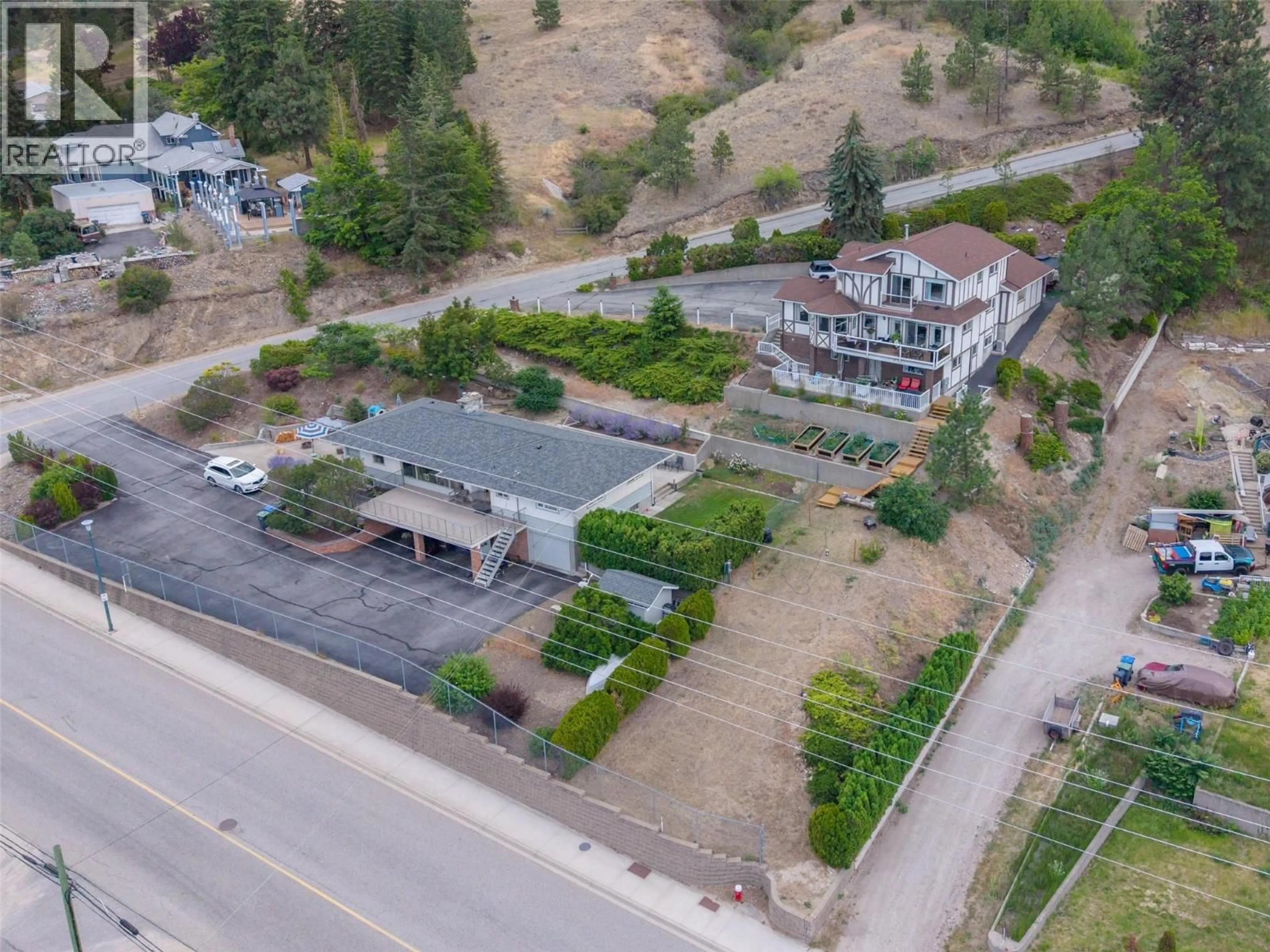 A pic from outside/outdoor area/front of a property/back of a property/a pic from drone, unknown for 8188 MILNE ROAD, Summerland British Columbia V0H1Z7