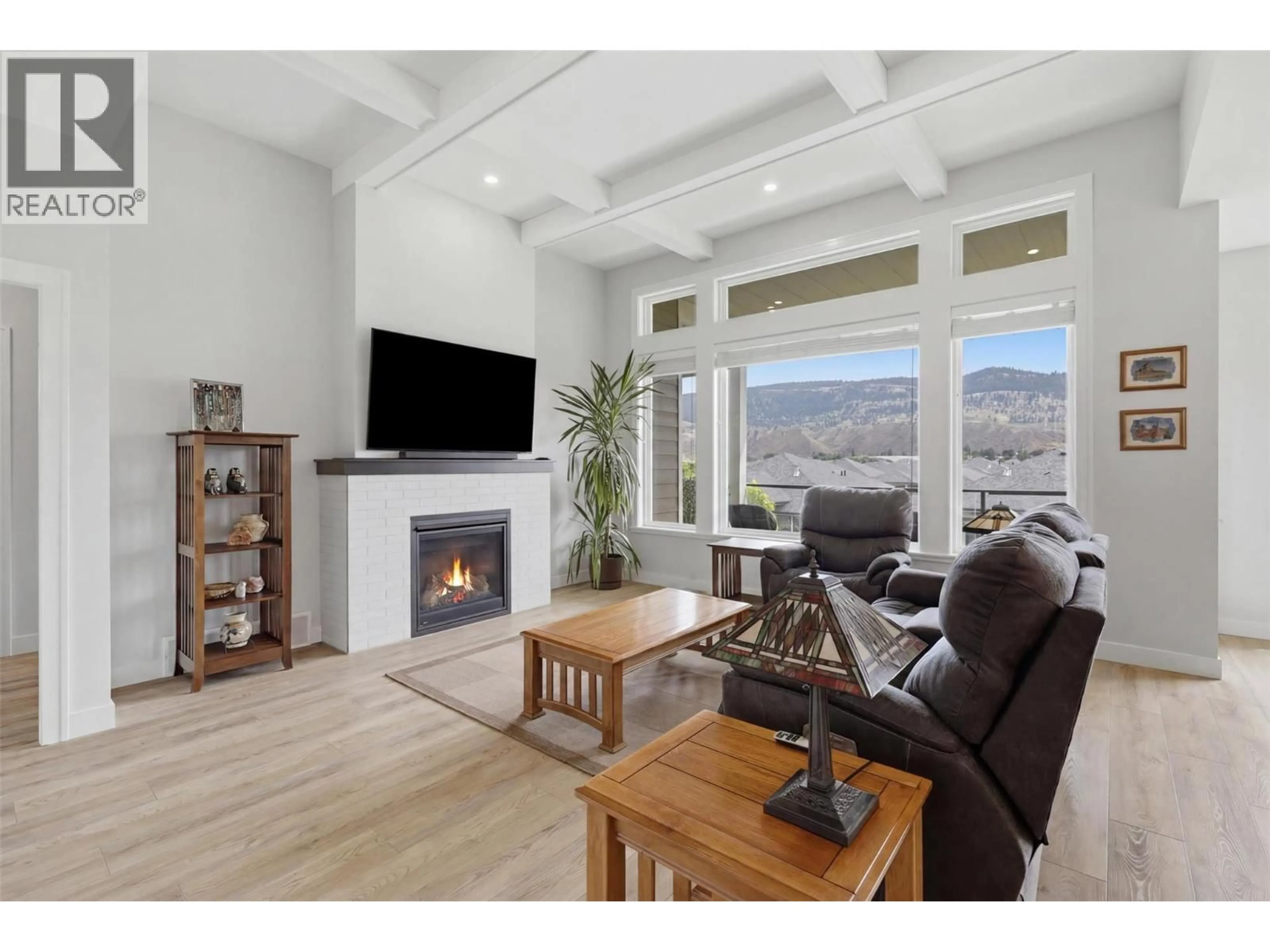 Living room with furniture, wood/laminate floor for 140 - 641 SHUSWAP ROAD EAST, Kamloops British Columbia V2H0E2