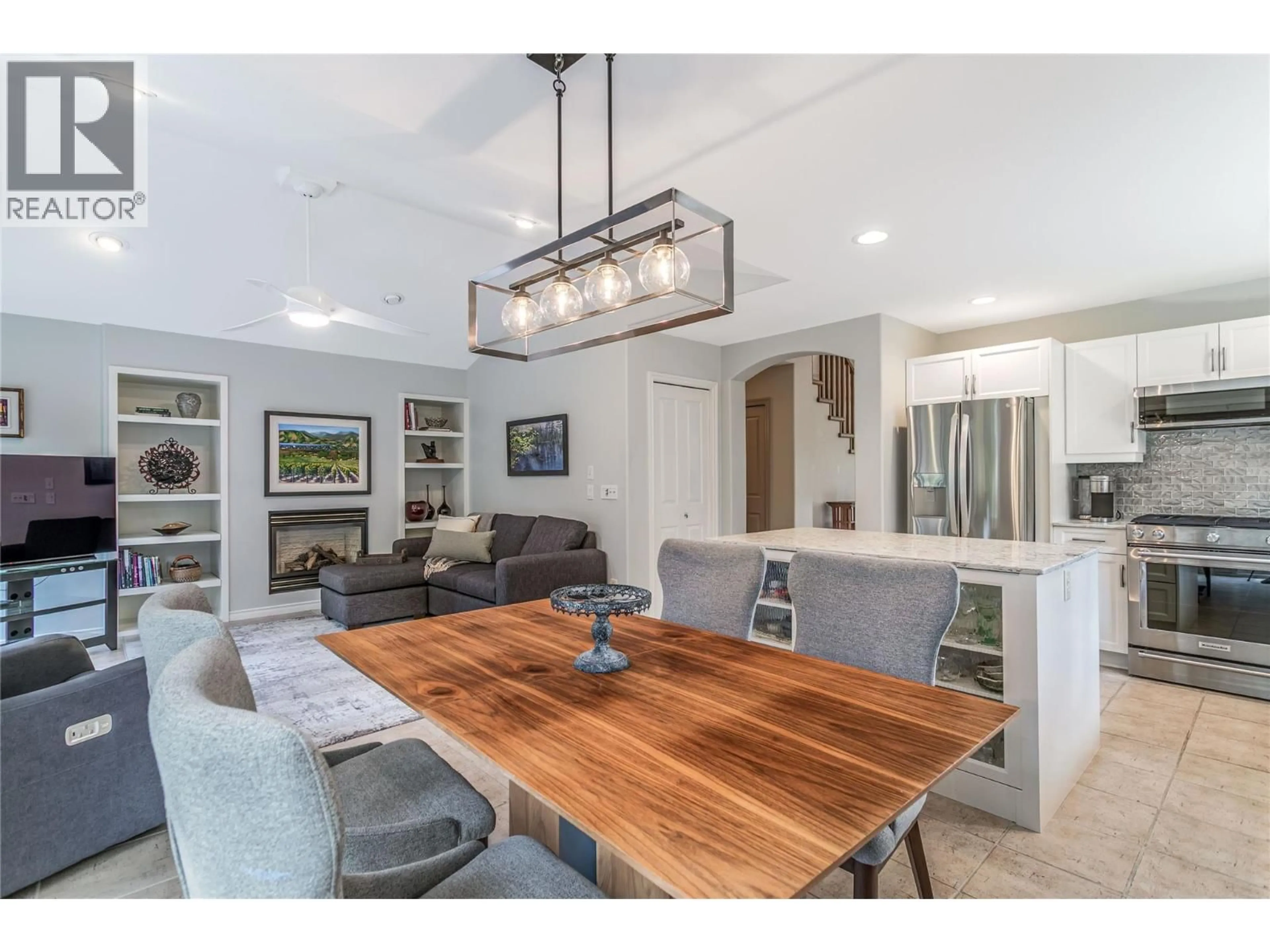 Open concept kitchen, wood/laminate floor for 4122 GALLAGHERS BOULEVARD SOUTH, Kelowna British Columbia V1W4V2