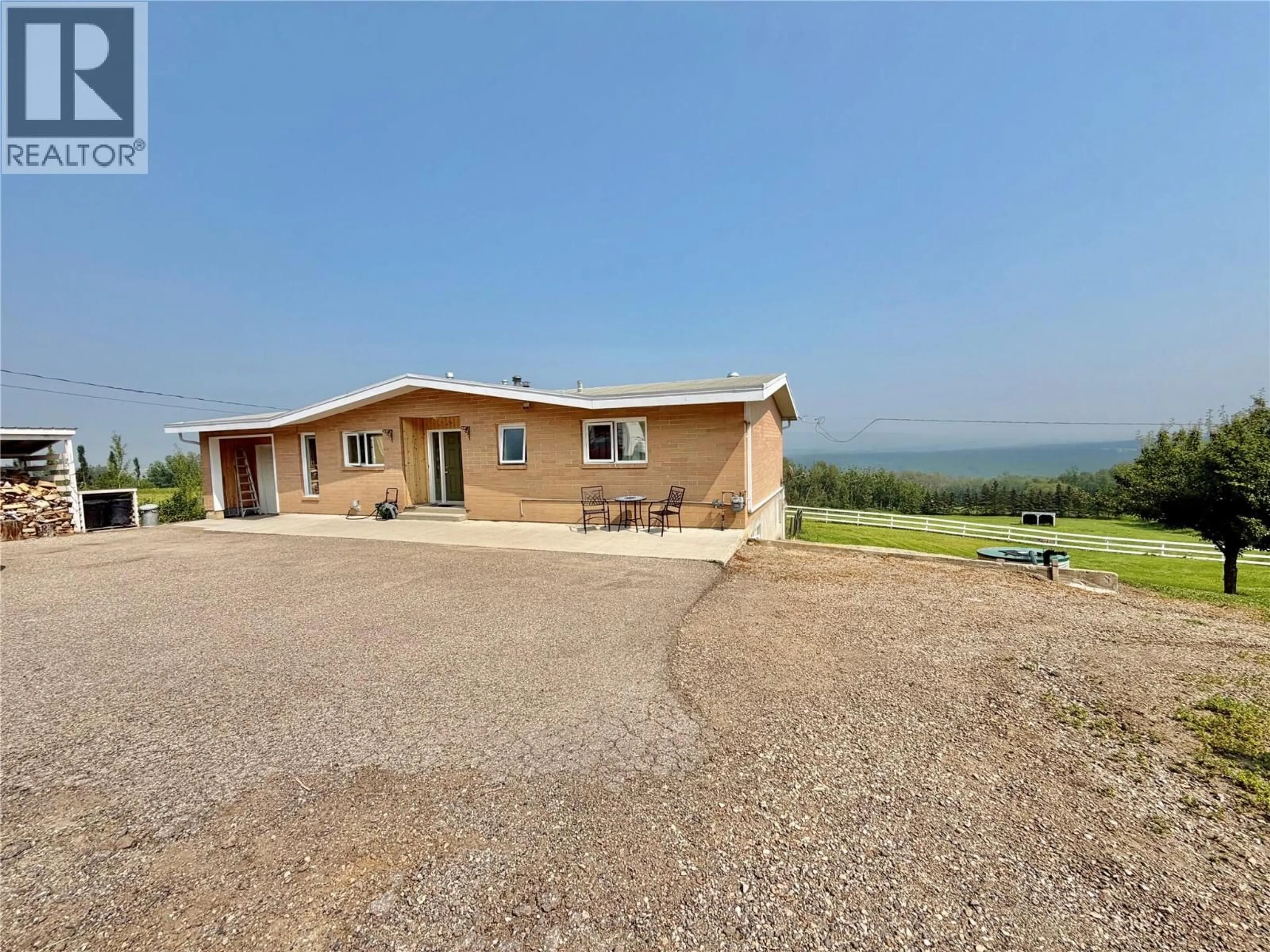 A pic from outside/outdoor area/front of a property/back of a property/a pic from drone, unknown for 13384 TRAIL WAY, Dawson Creek British Columbia V1G0H3