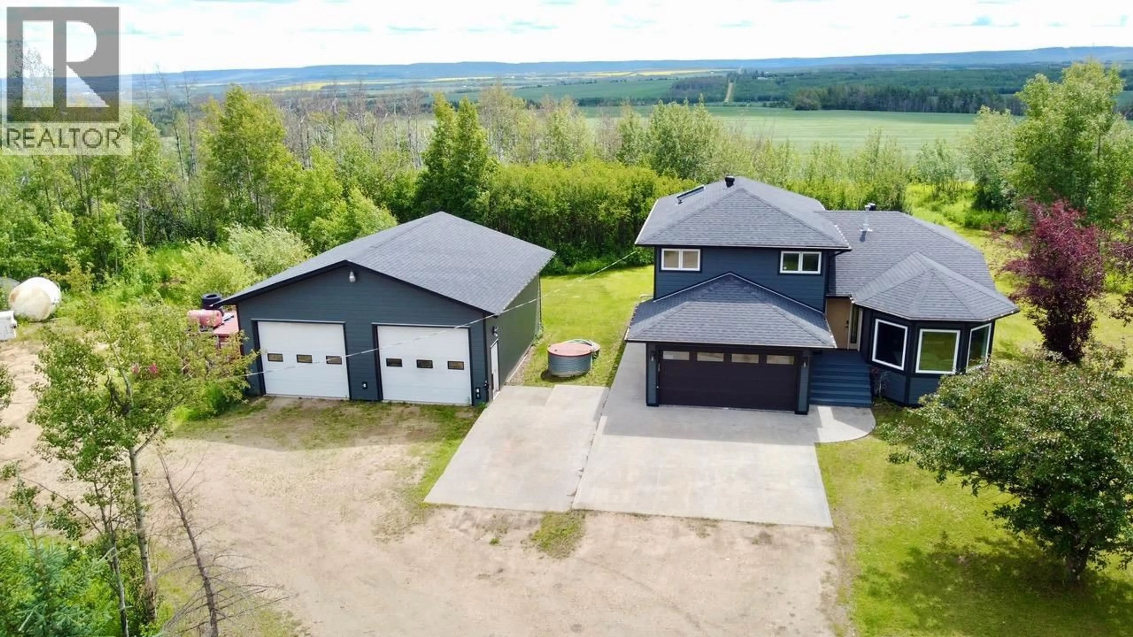 A pic from outside/outdoor area/front of a property/back of a property/a pic from drone, building for 6385 97 HIGHWAY, Dawson Creek British Columbia V1G4E7