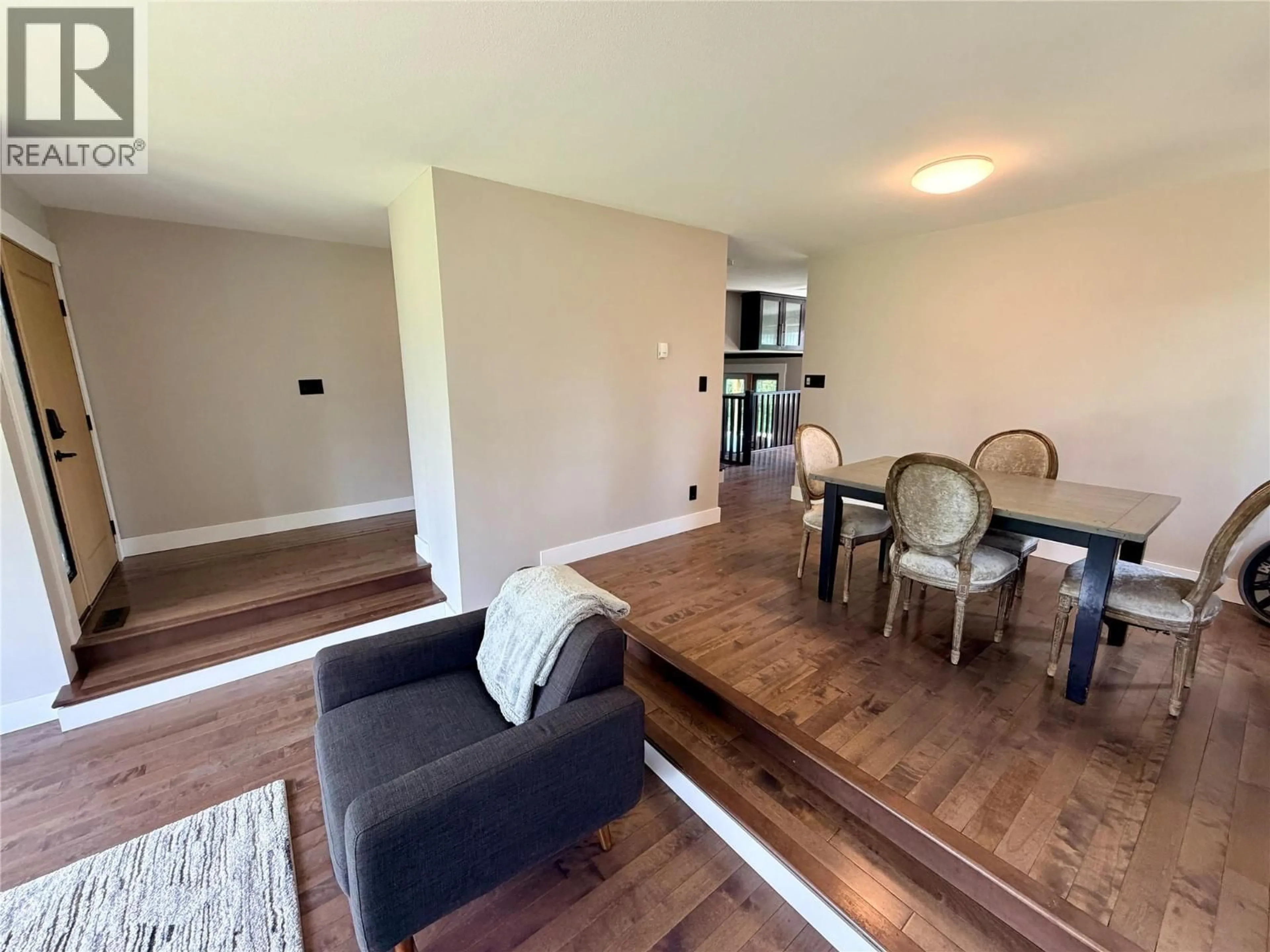 Living room with furniture, wood/laminate floor for 6385 97 HIGHWAY, Dawson Creek British Columbia V1G4E7