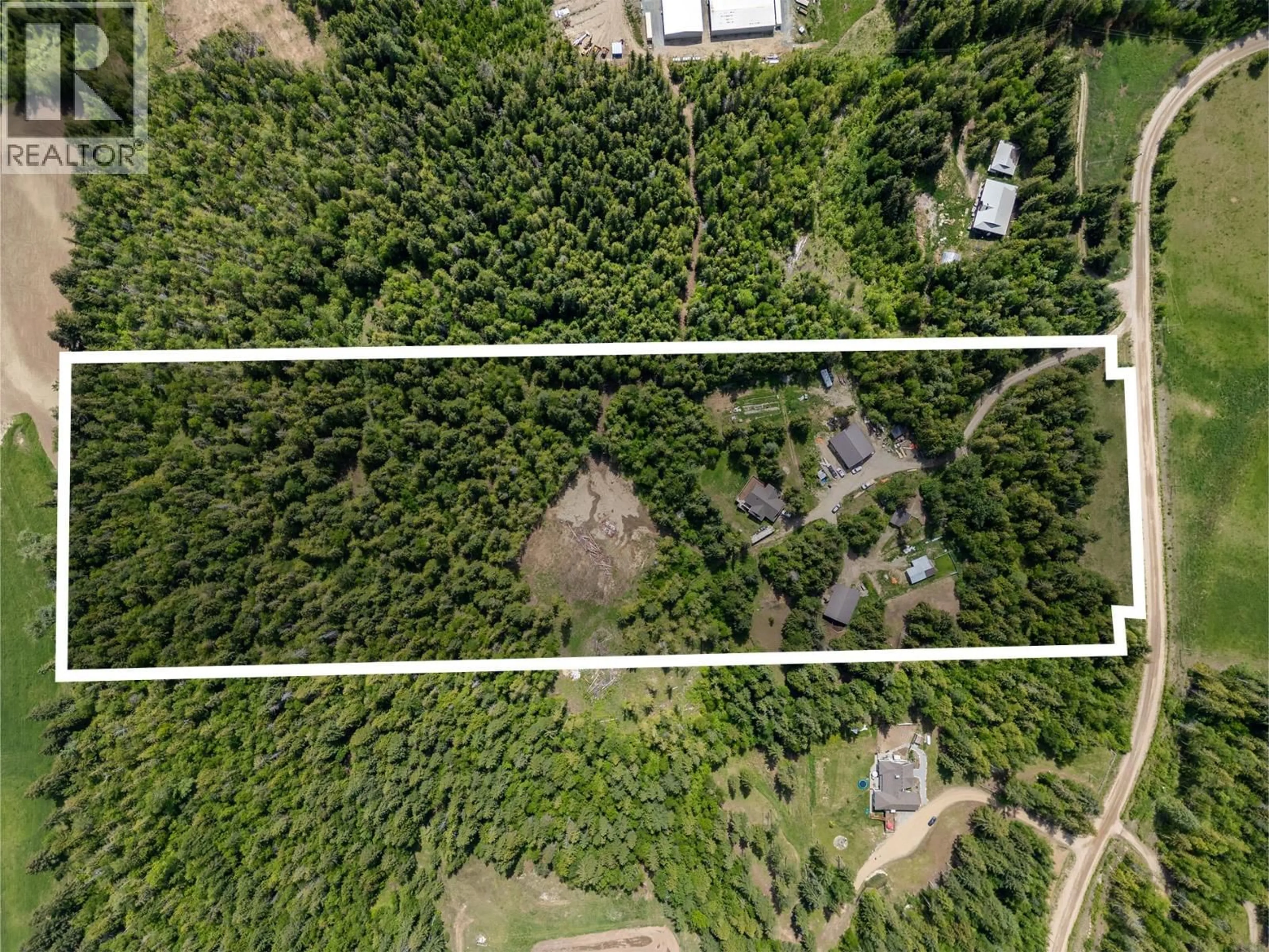 A pic from outside/outdoor area/front of a property/back of a property/a pic from drone, forest/trees view for 63 LIBICH ROAD, Salmon Arm British Columbia V1E2Y1